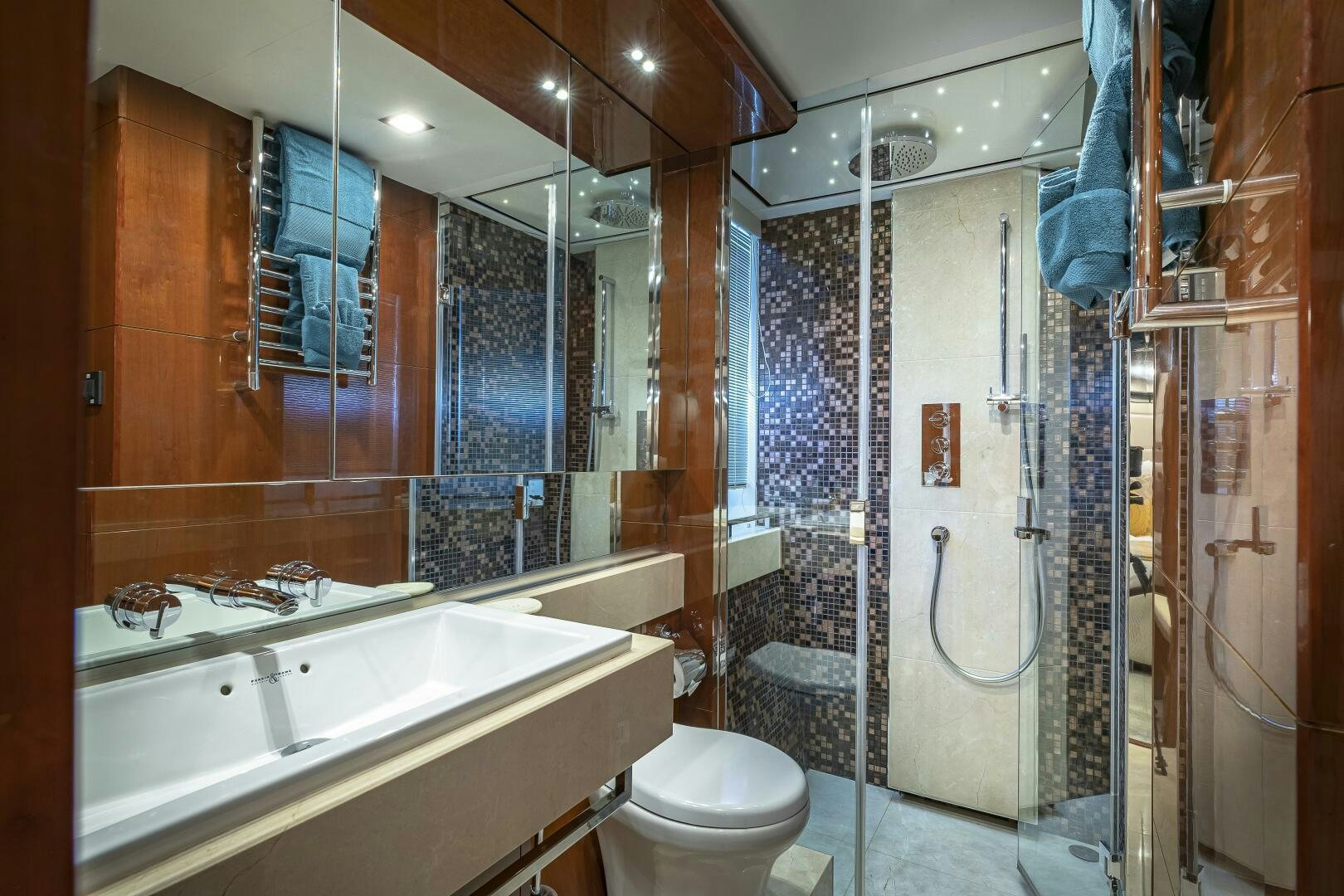 a bathroom with a glass shower aboard BEACHFRONT II Yacht for Sale