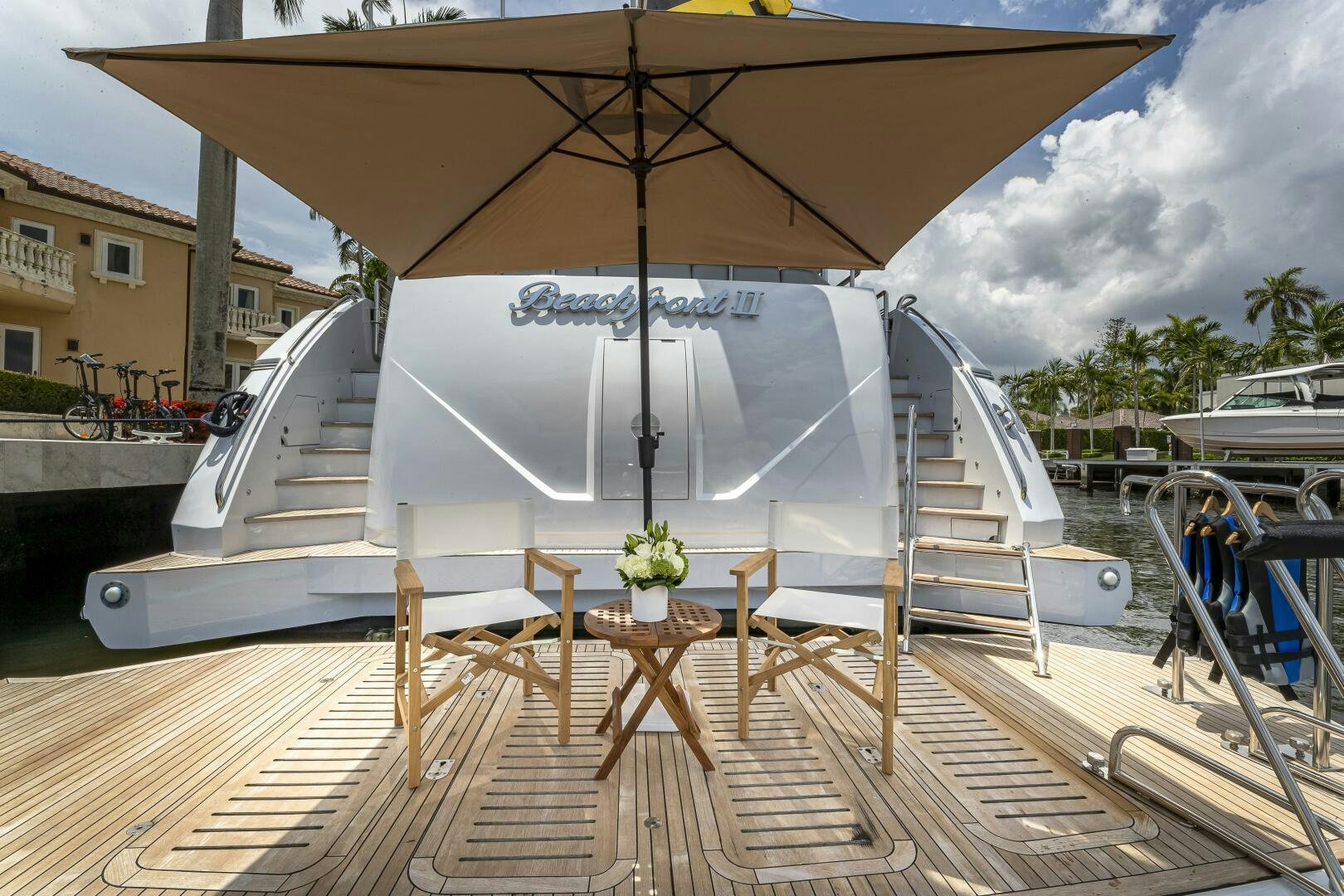 a large white boat on a dock aboard BEACHFRONT II Yacht for Sale