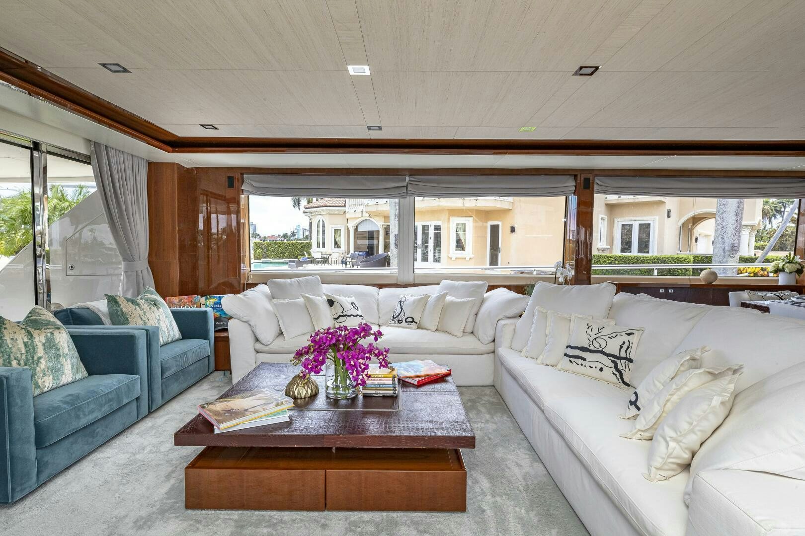 a living room with a couch and a table aboard BEACHFRONT II Yacht for Sale