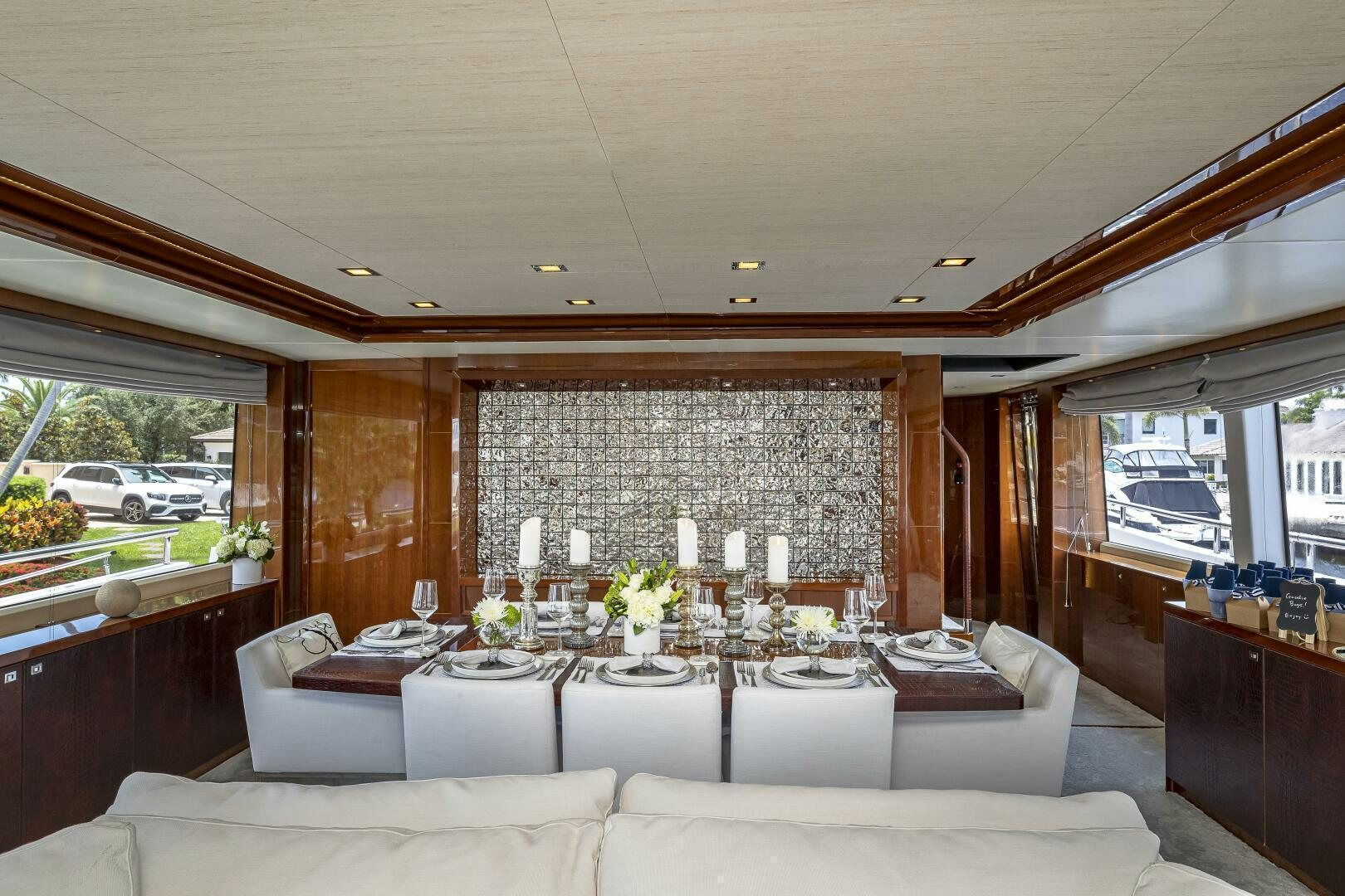 a living room with a large window aboard BEACHFRONT II Yacht for Sale