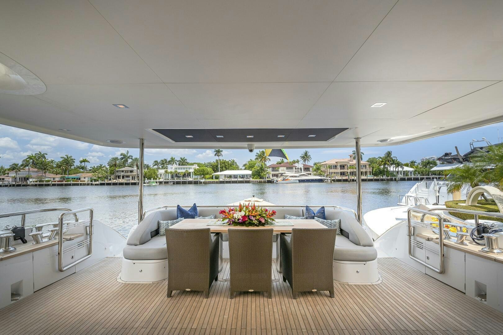 a room with a table chairs and a large window overlooking a body of water aboard BEACHFRONT II Yacht for Sale