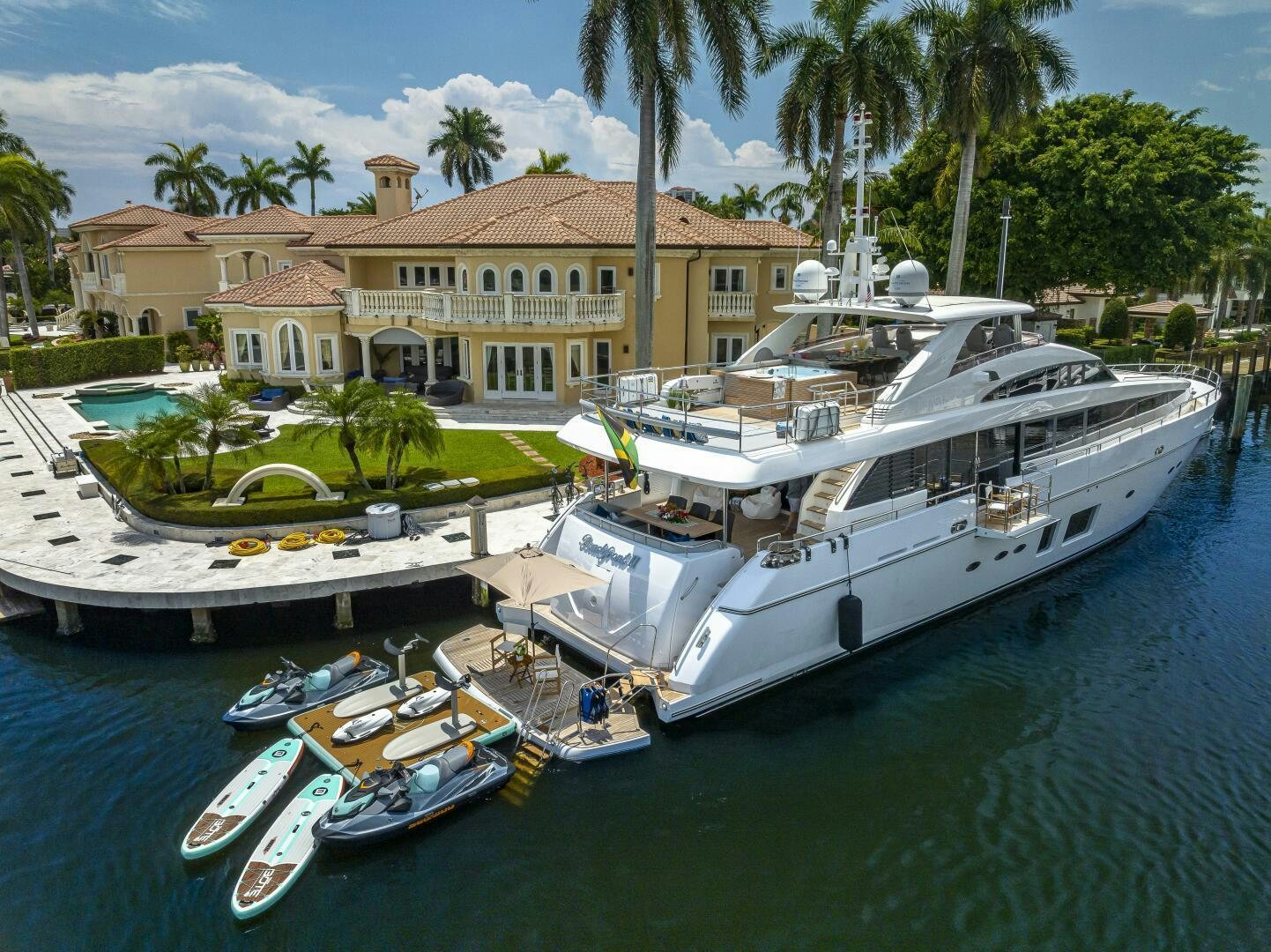 a boat docked at a pier aboard BEACHFRONT II Yacht for Sale