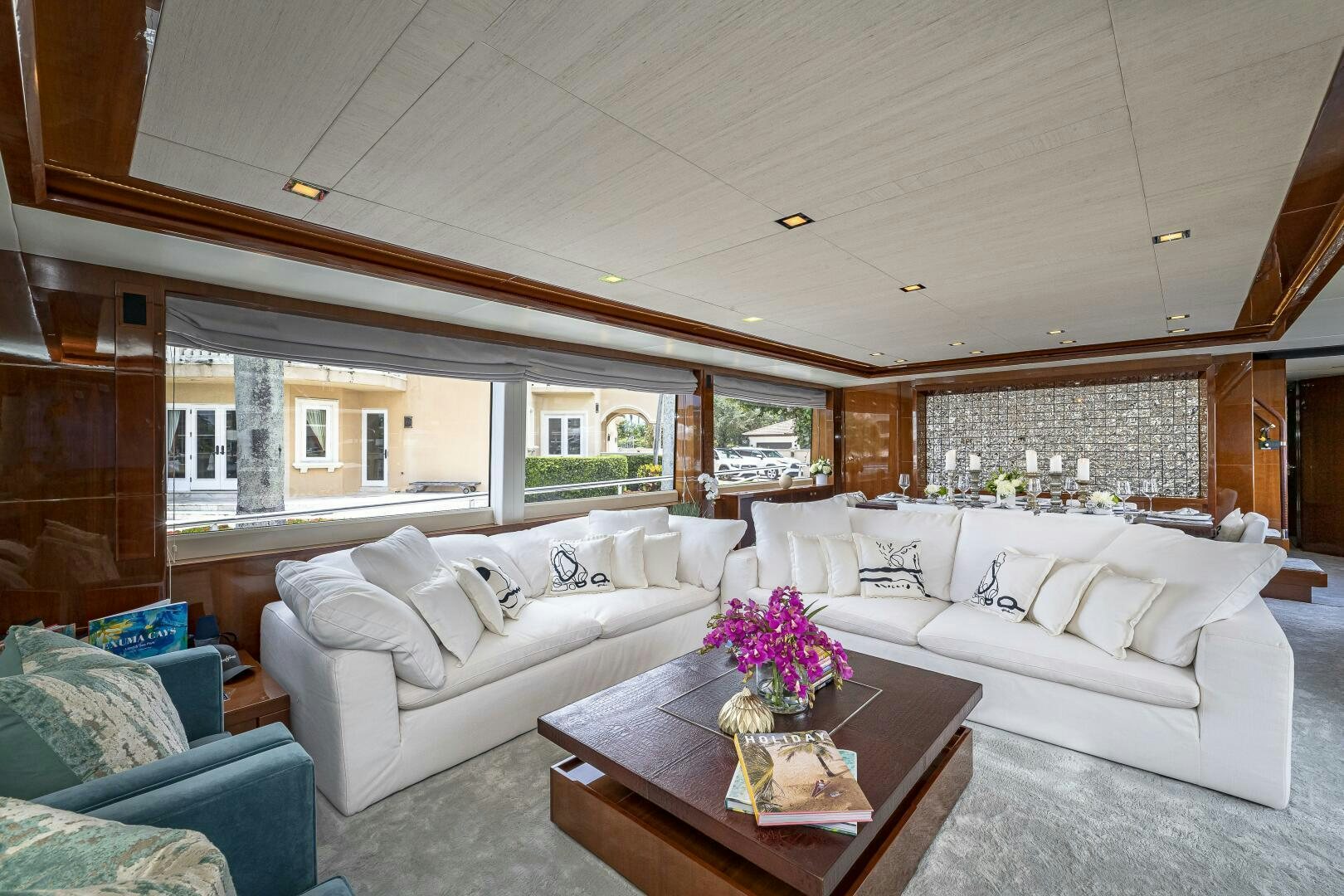 a living room with a couch and a table aboard BEACHFRONT II Yacht for Sale