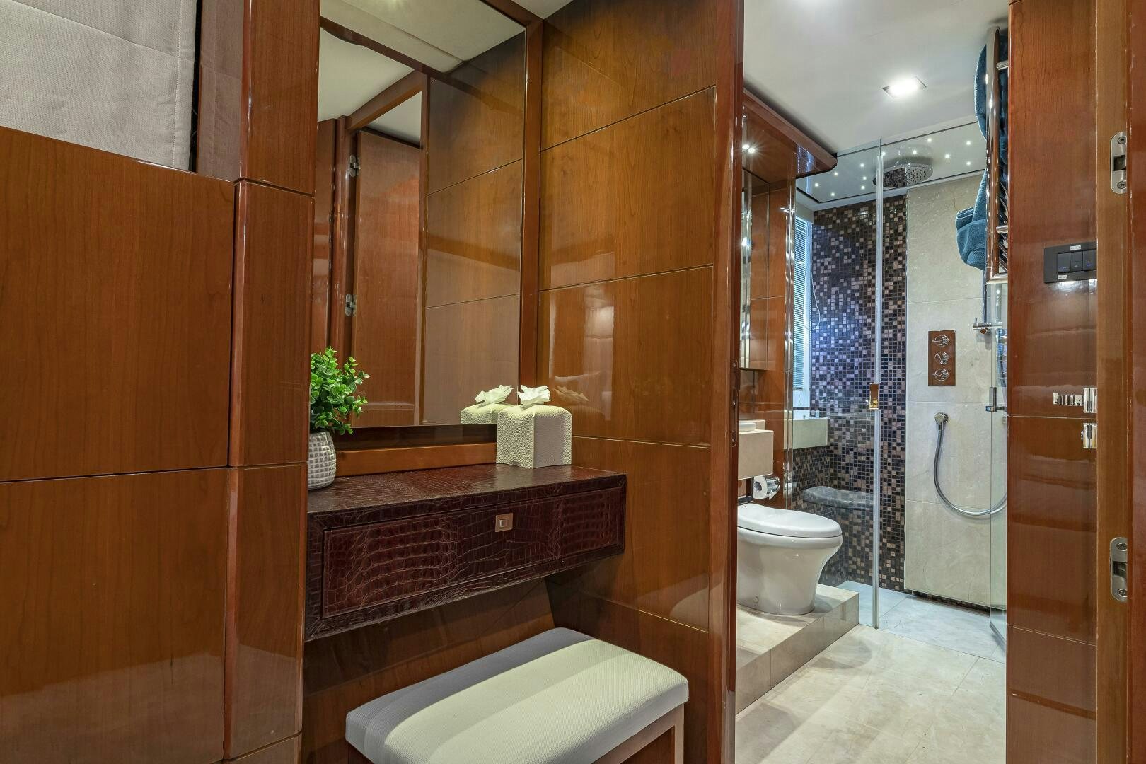 a bathroom with a glass shower aboard BEACHFRONT II Yacht for Sale