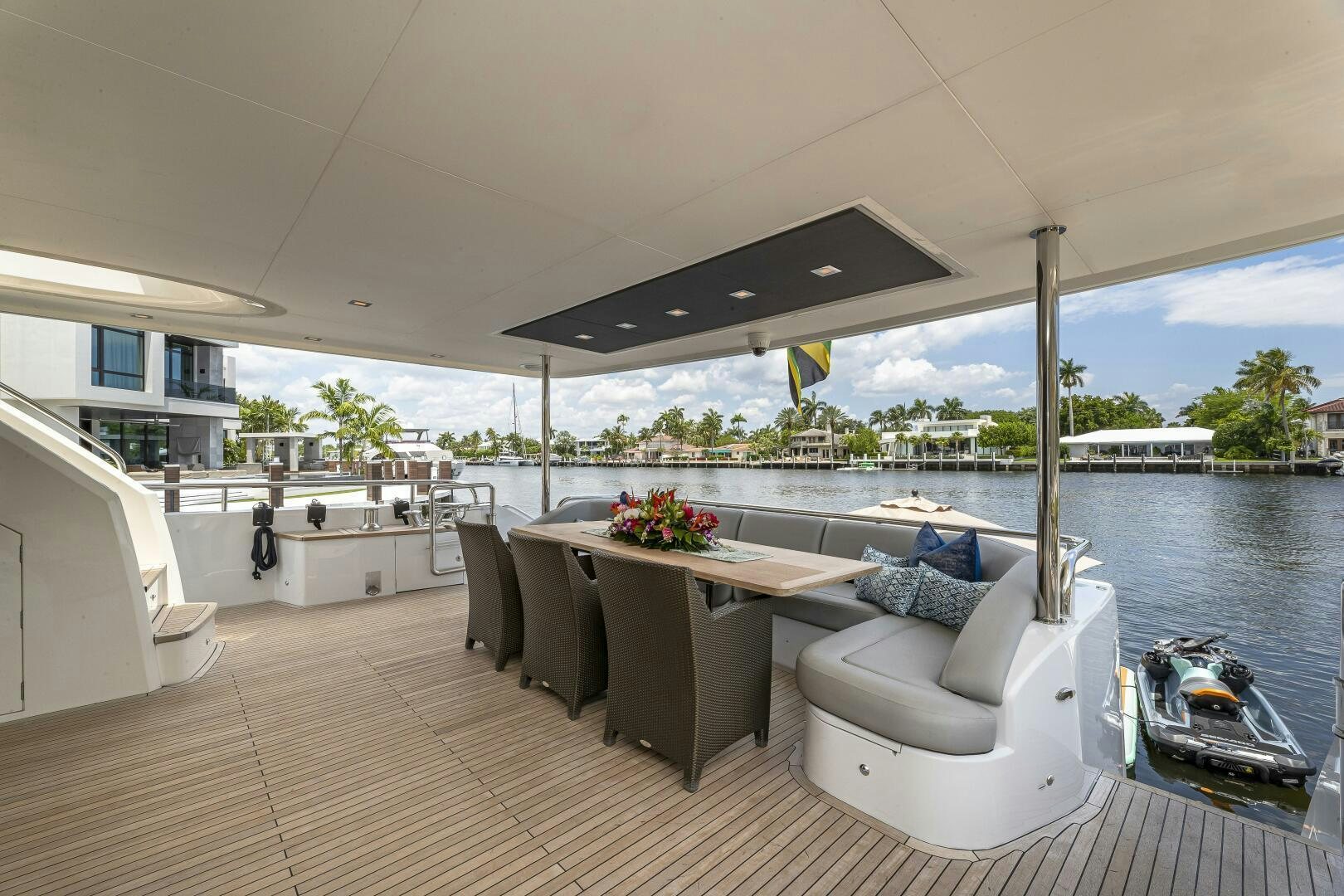 a large living room with a large patio and a pool aboard BEACHFRONT II Yacht for Sale