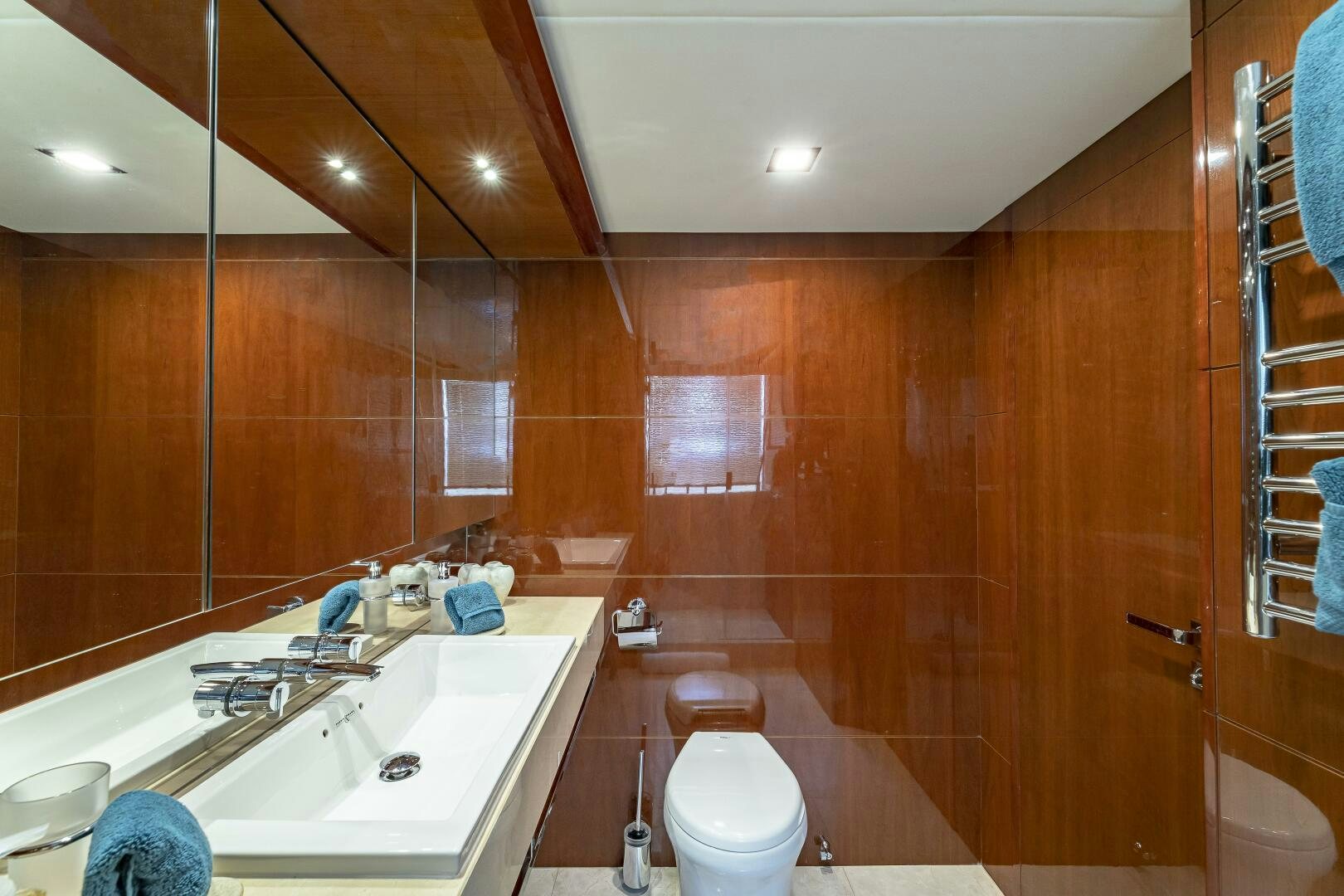 a bathroom with a sink and a toilet aboard BEACHFRONT II Yacht for Sale