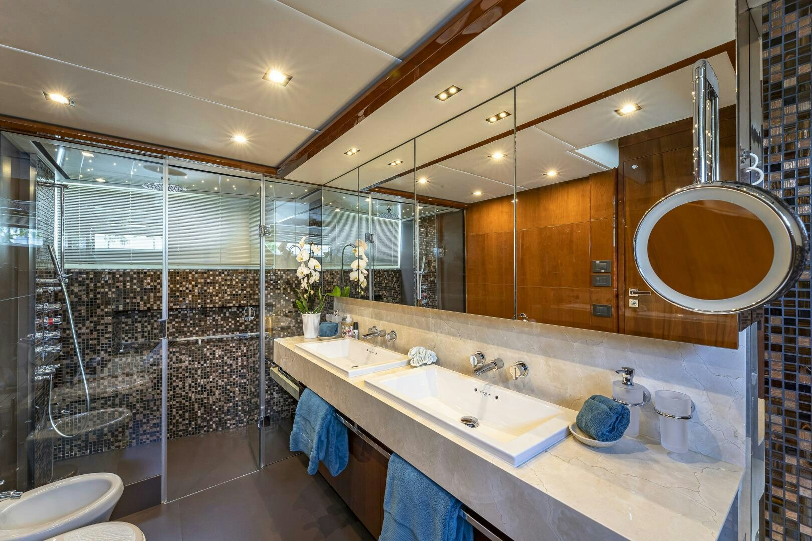 a bathroom with a large mirror aboard BEACHFRONT II Yacht for Sale
