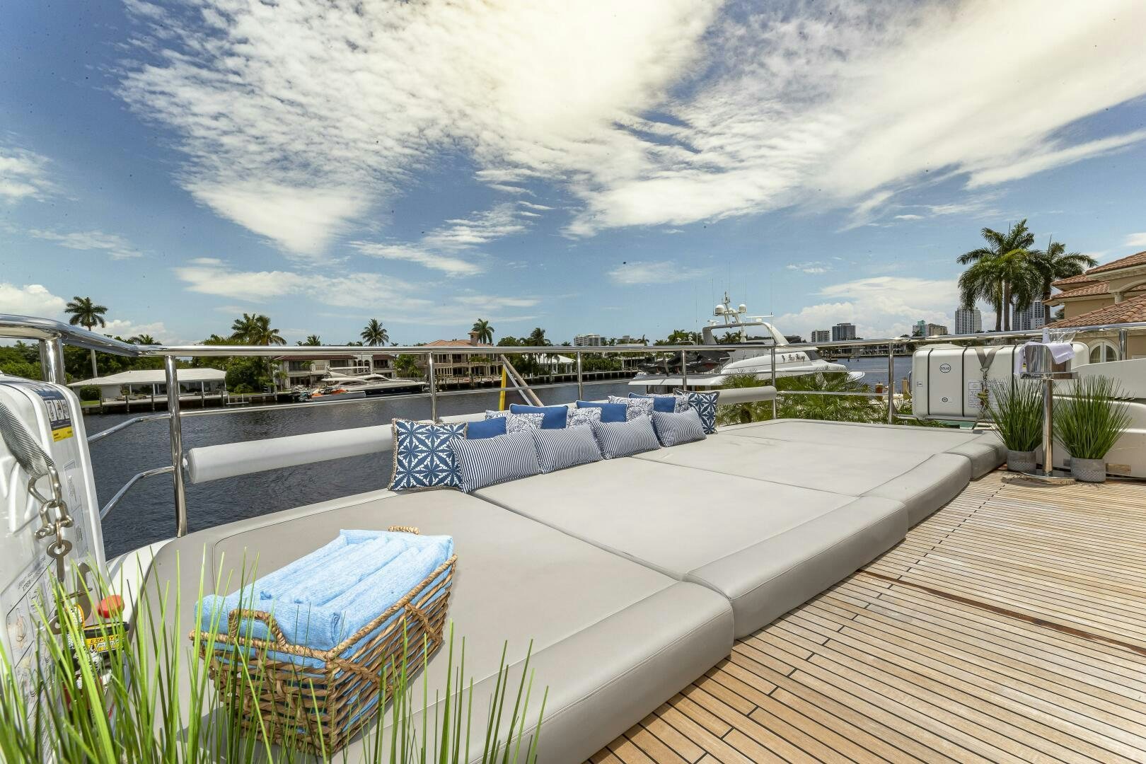 a deck with a pool and plants aboard BEACHFRONT II Yacht for Sale