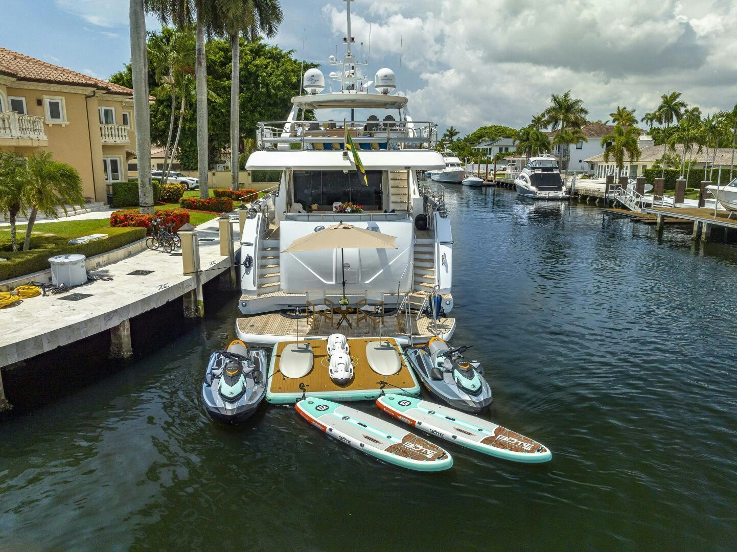 a boat docked at a pier aboard BEACHFRONT II Yacht for Sale