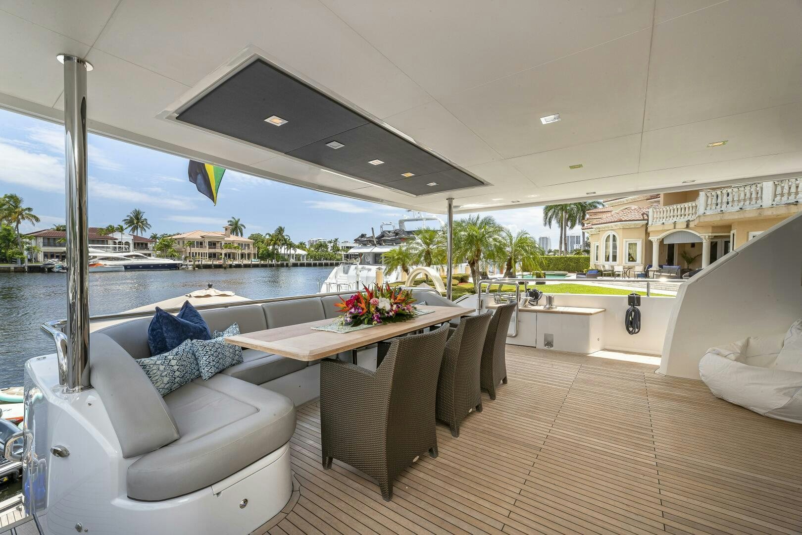 a large living room with a large patio and a pool aboard BEACHFRONT II Yacht for Sale