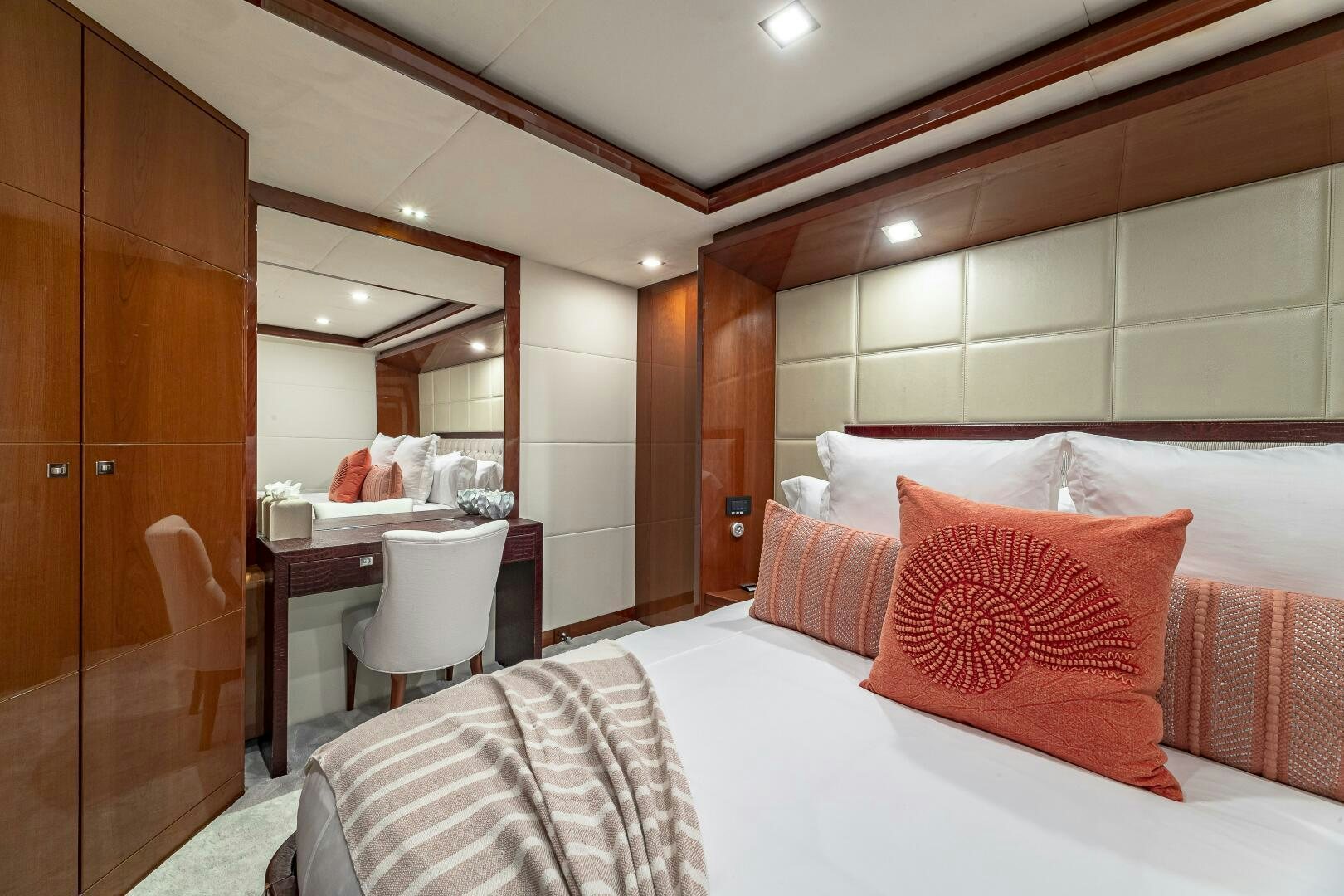 a hotel room with a bed and desk aboard BEACHFRONT II Yacht for Sale