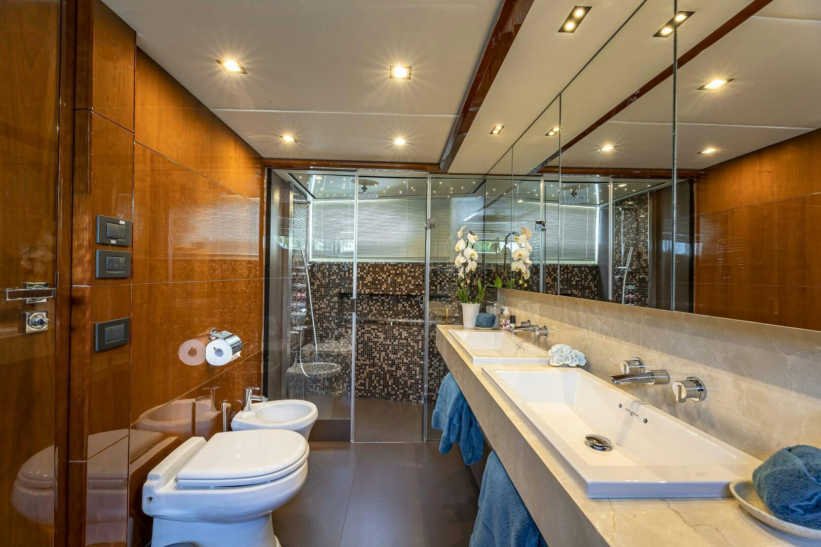 a bathroom with a glass shower aboard BEACHFRONT II Yacht for Sale