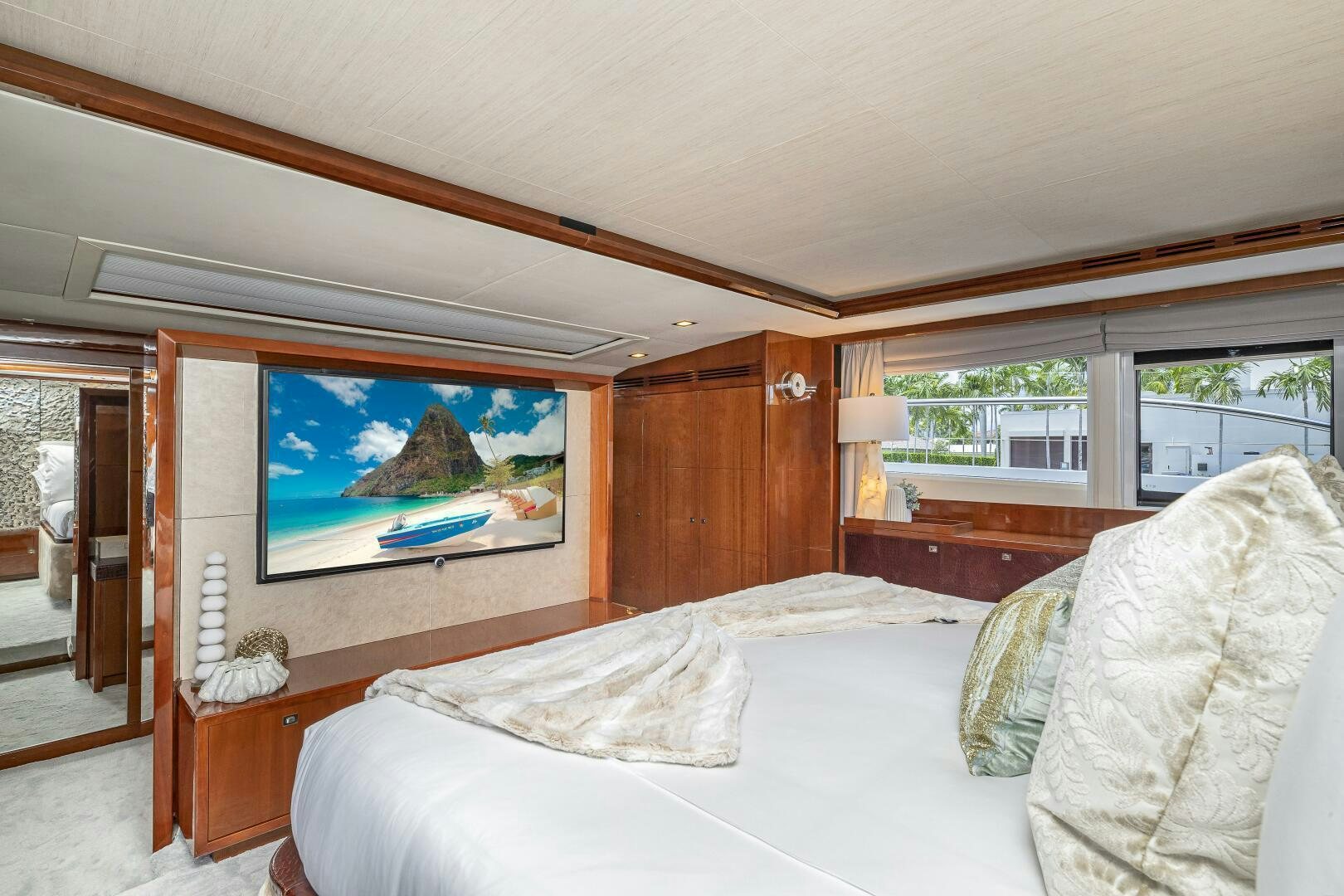 a bedroom with a large bed aboard BEACHFRONT II Yacht for Sale