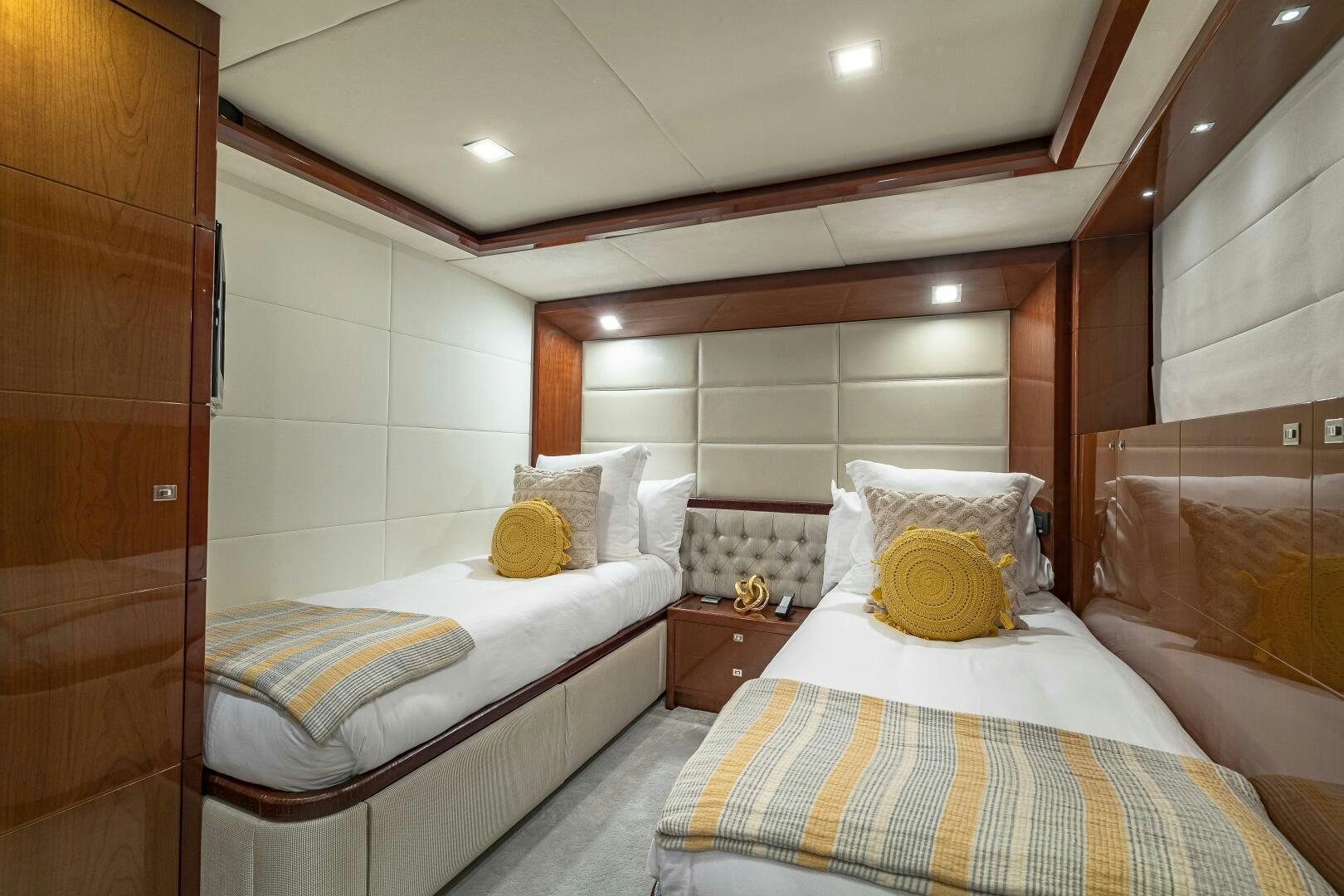 a room with two beds aboard BEACHFRONT II Yacht for Sale