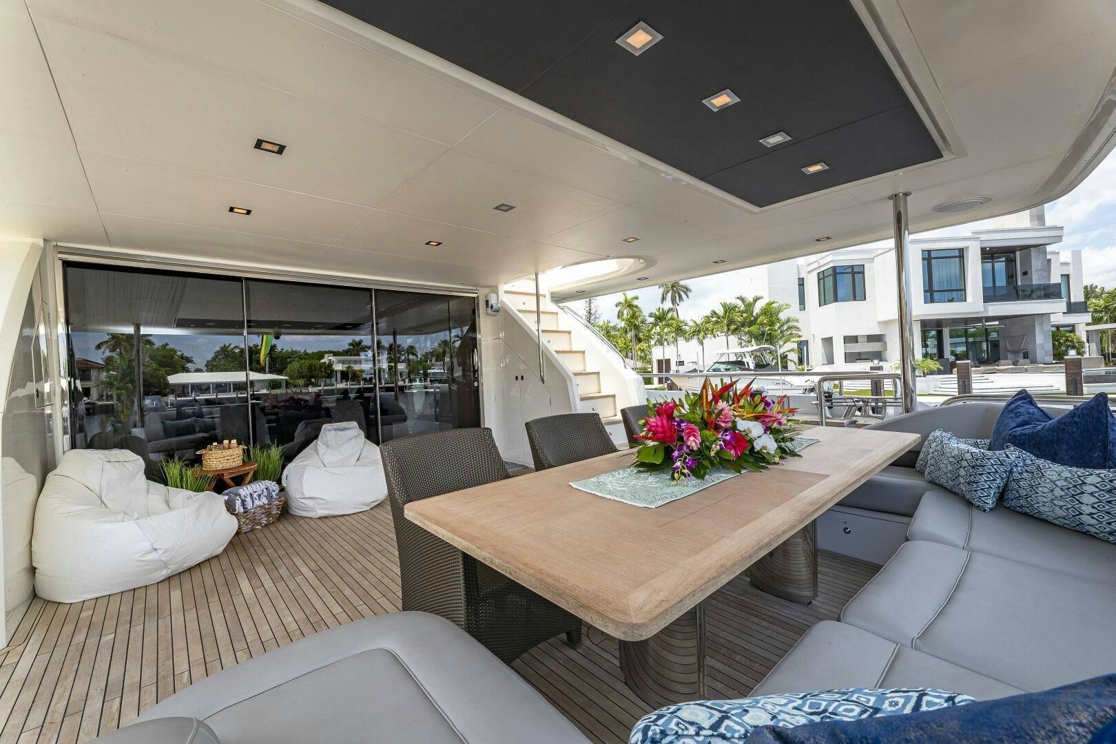 a living room with a large glass window aboard BEACHFRONT II Yacht for Sale