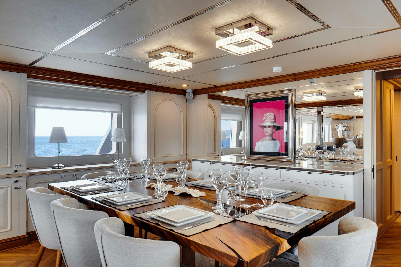 a dining room with a table and chairs aboard EVA Yacht for Sale