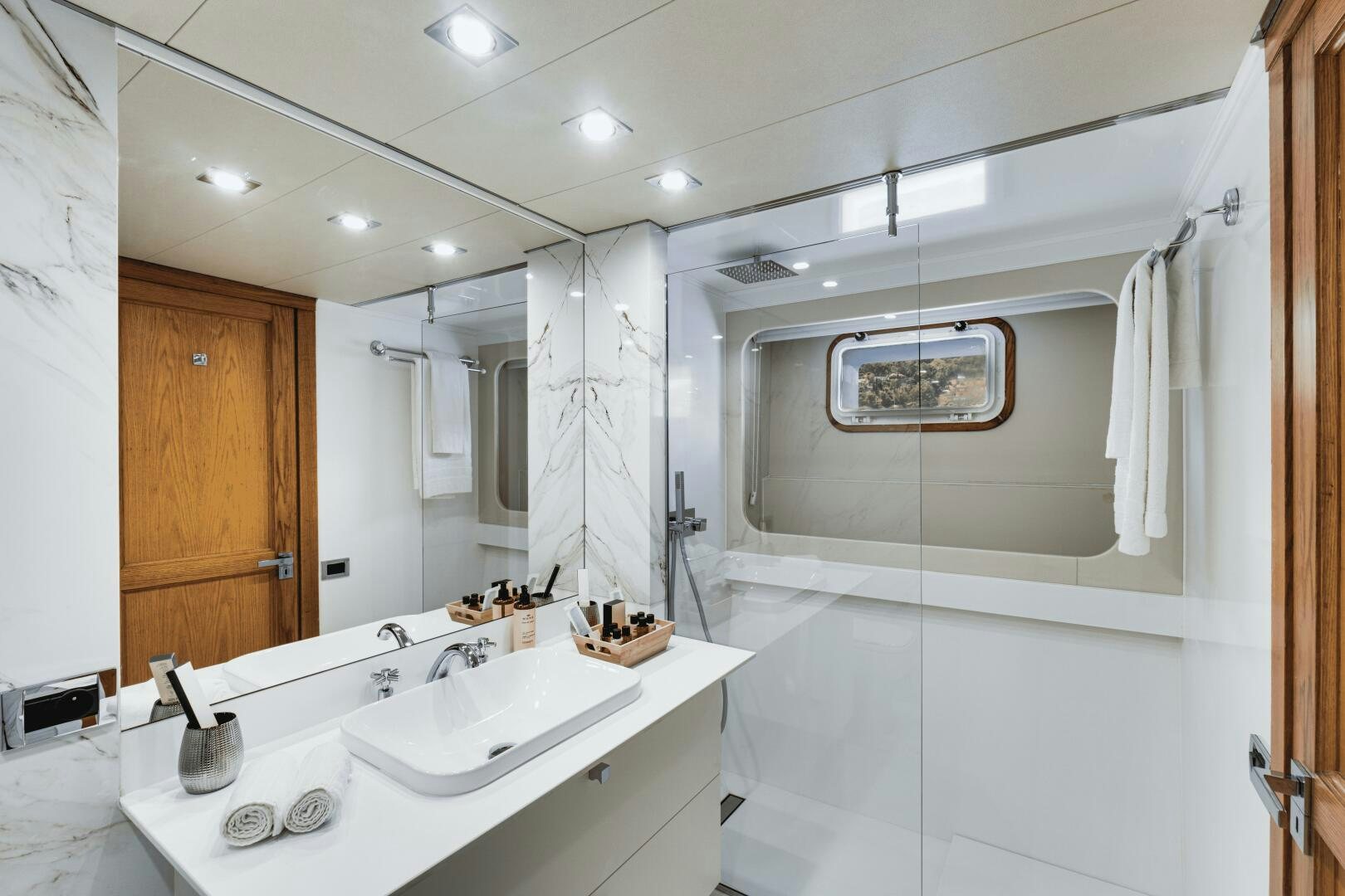 a bathroom with a sink and a mirror aboard EVA Yacht for Sale