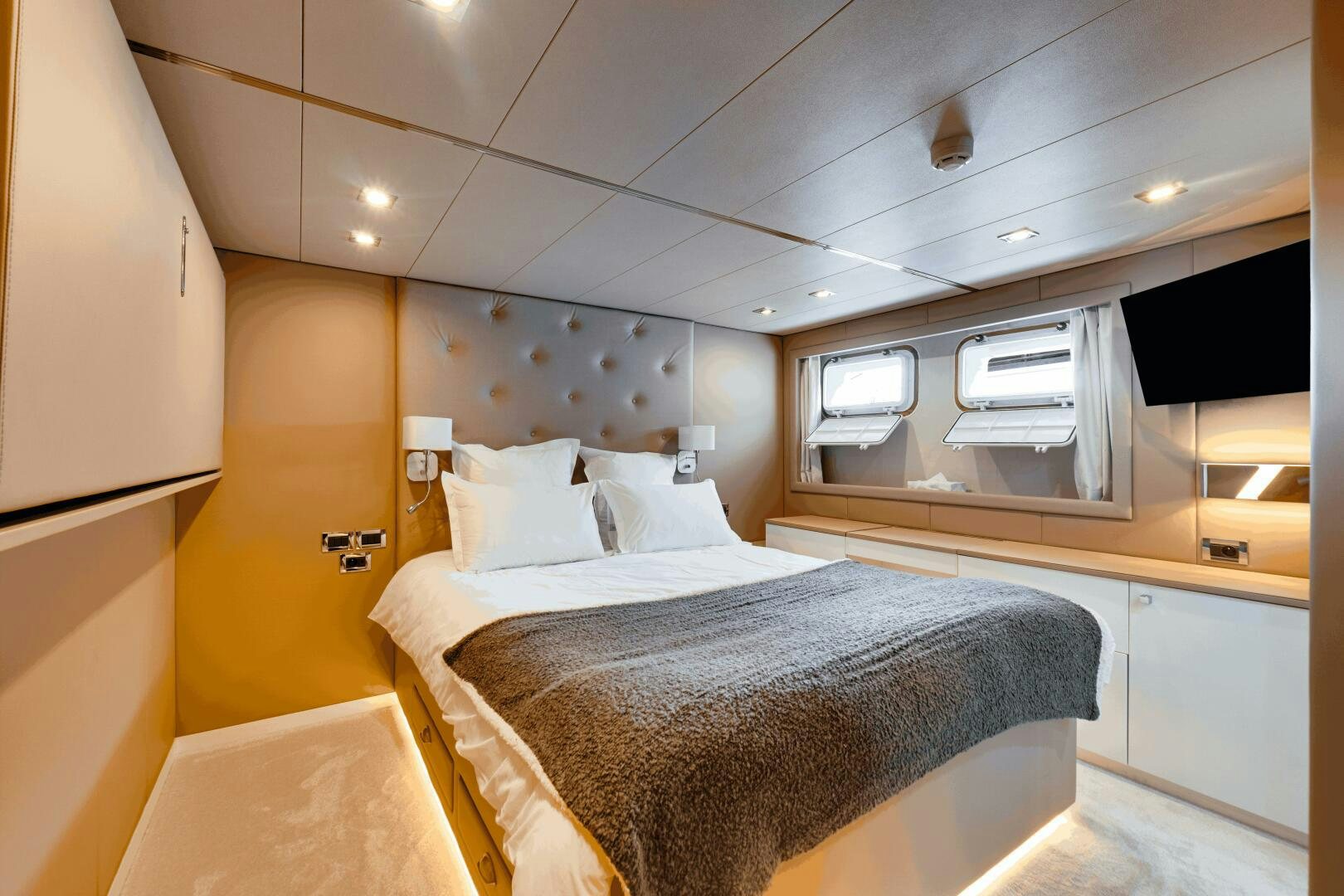 a room with a bed and a window aboard EVA Yacht for Sale