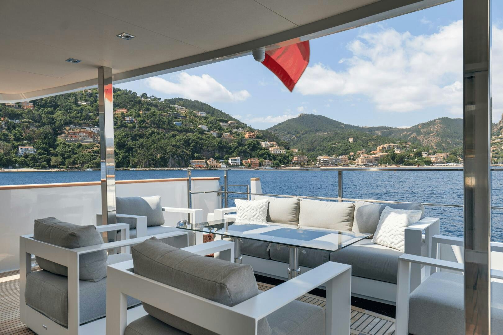 a room with a couch and a large body of water aboard EVA Yacht for Sale
