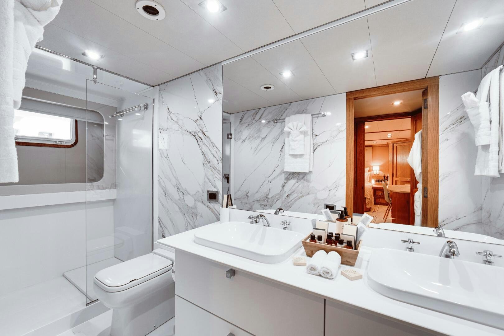 a bathroom with a large mirror aboard EVA Yacht for Sale