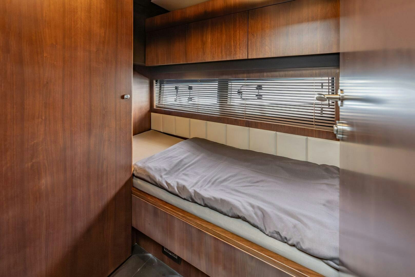 a bed in a room aboard NOROADER Yacht for Sale