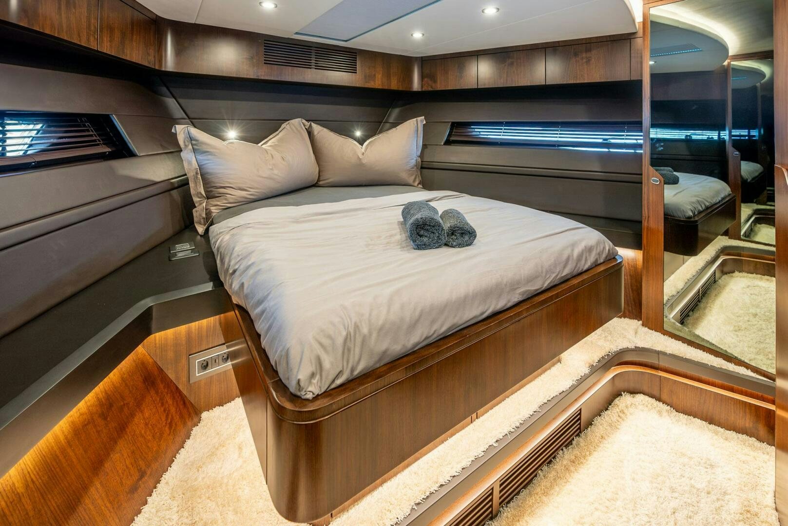 a bed in a room aboard NOROADER Yacht for Sale