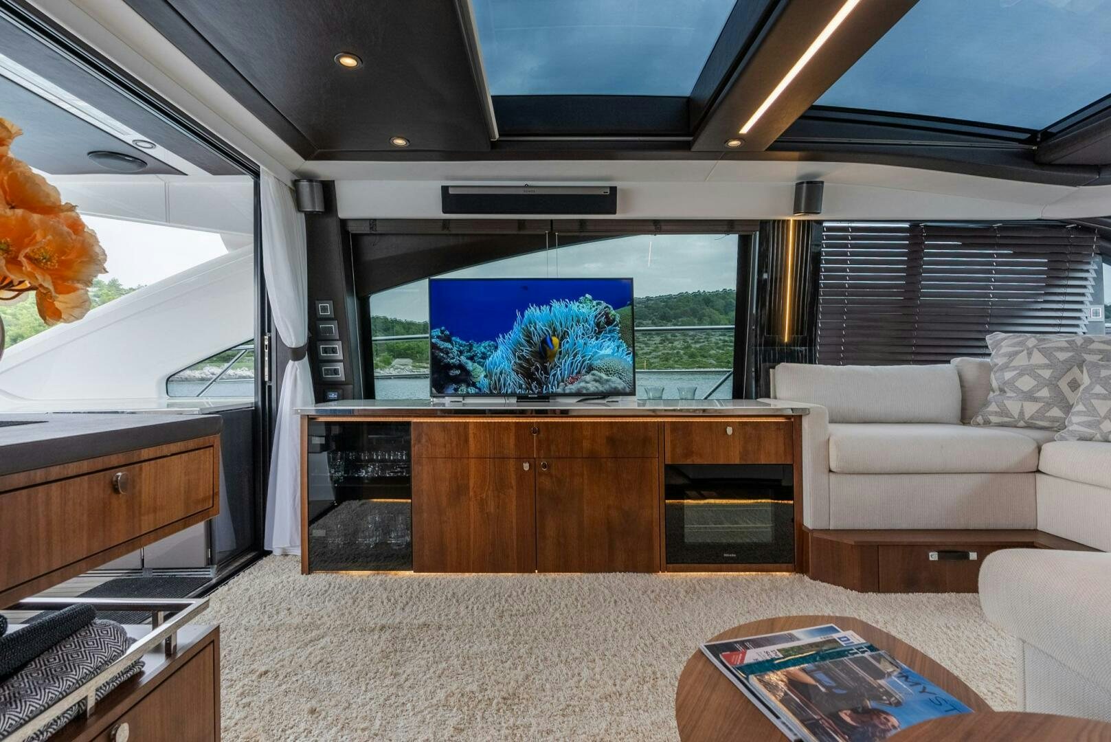 a living room with a large fish tank aboard NOROADER Yacht for Sale