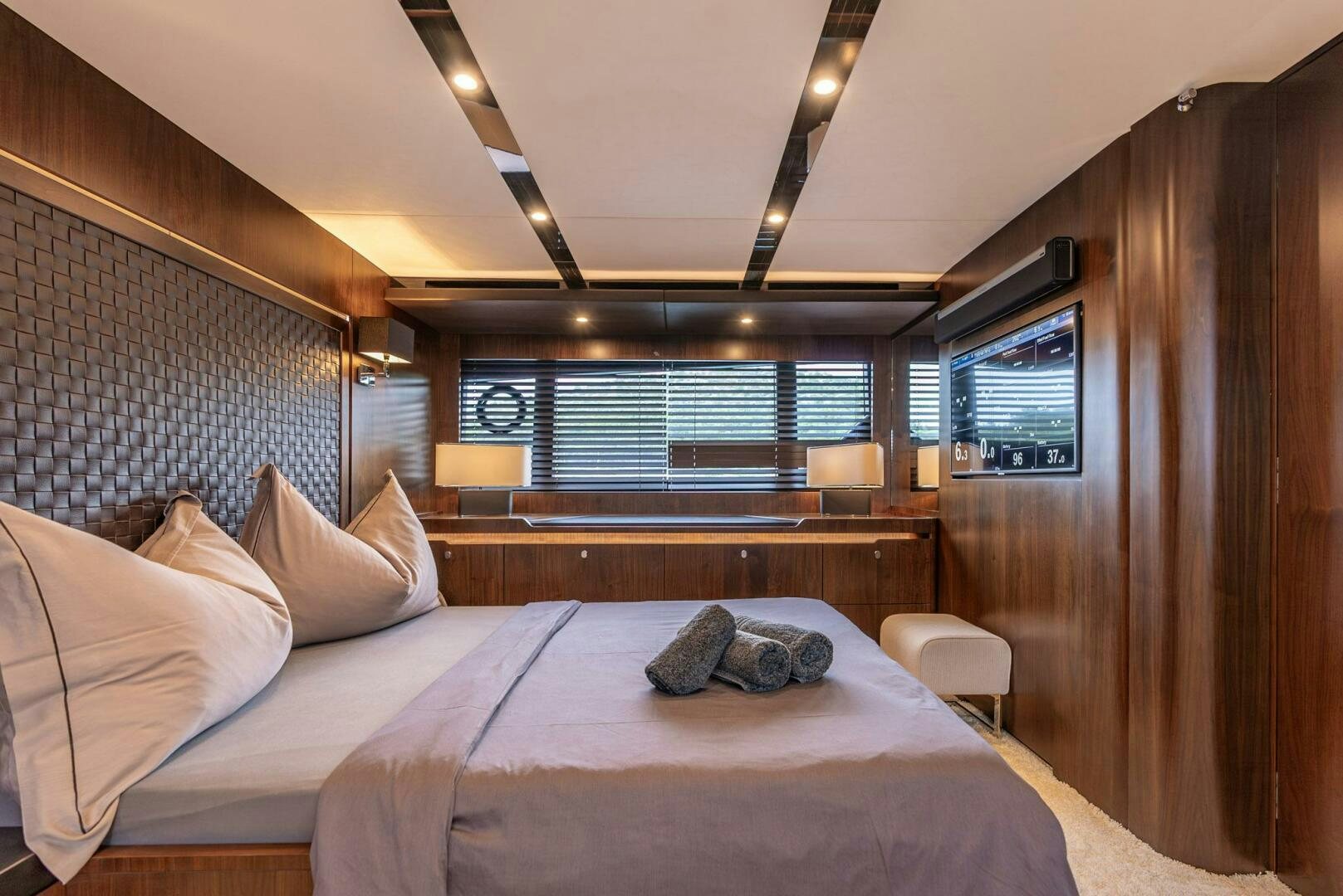 a bed with pillows on it aboard NOROADER Yacht for Sale