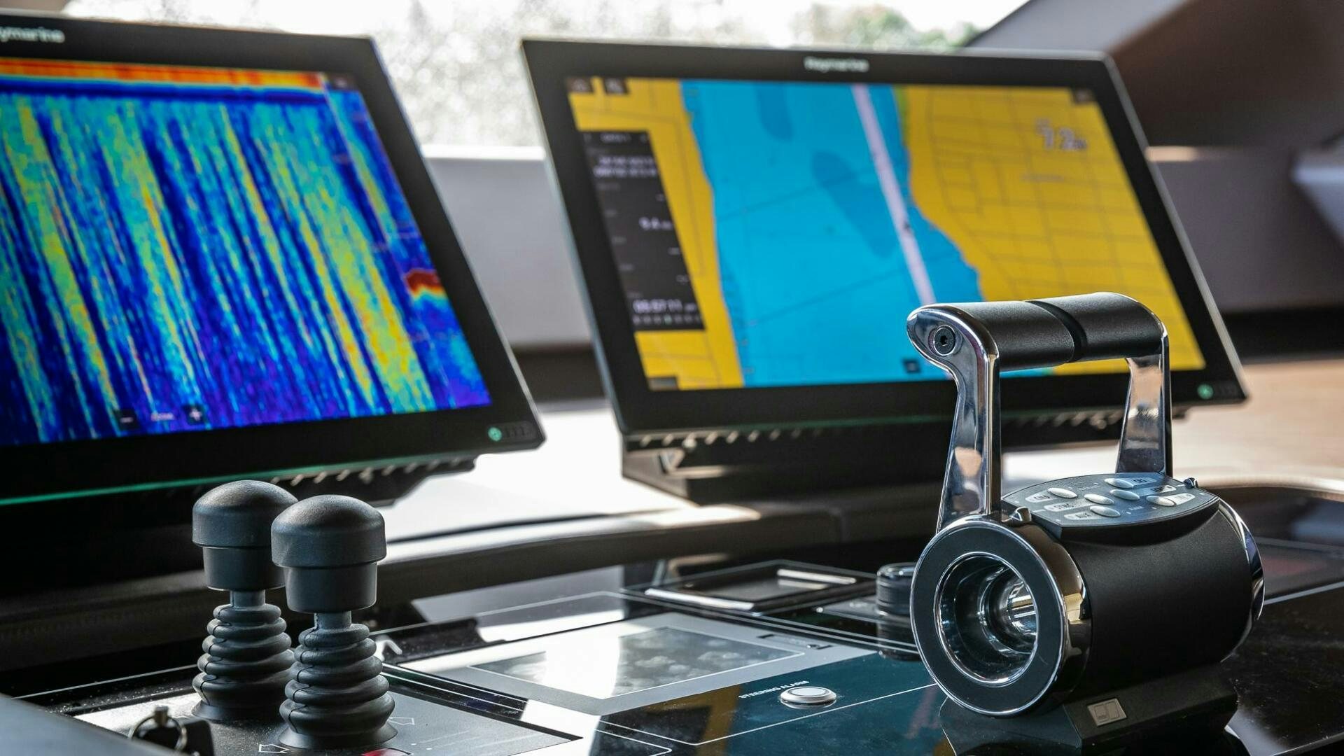 a camera on a table aboard WOMBAT Yacht for Sale