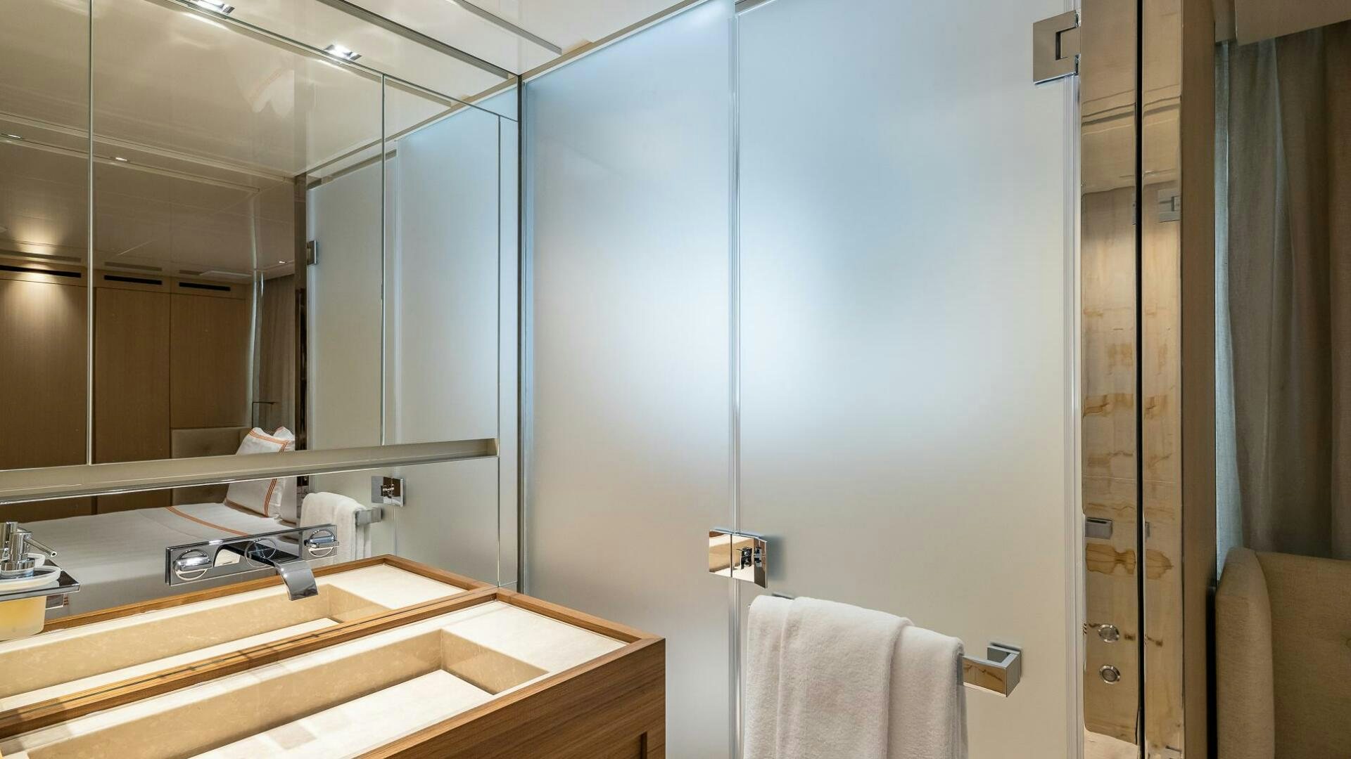 a bathroom with a large mirror aboard WOMBAT Yacht for Sale