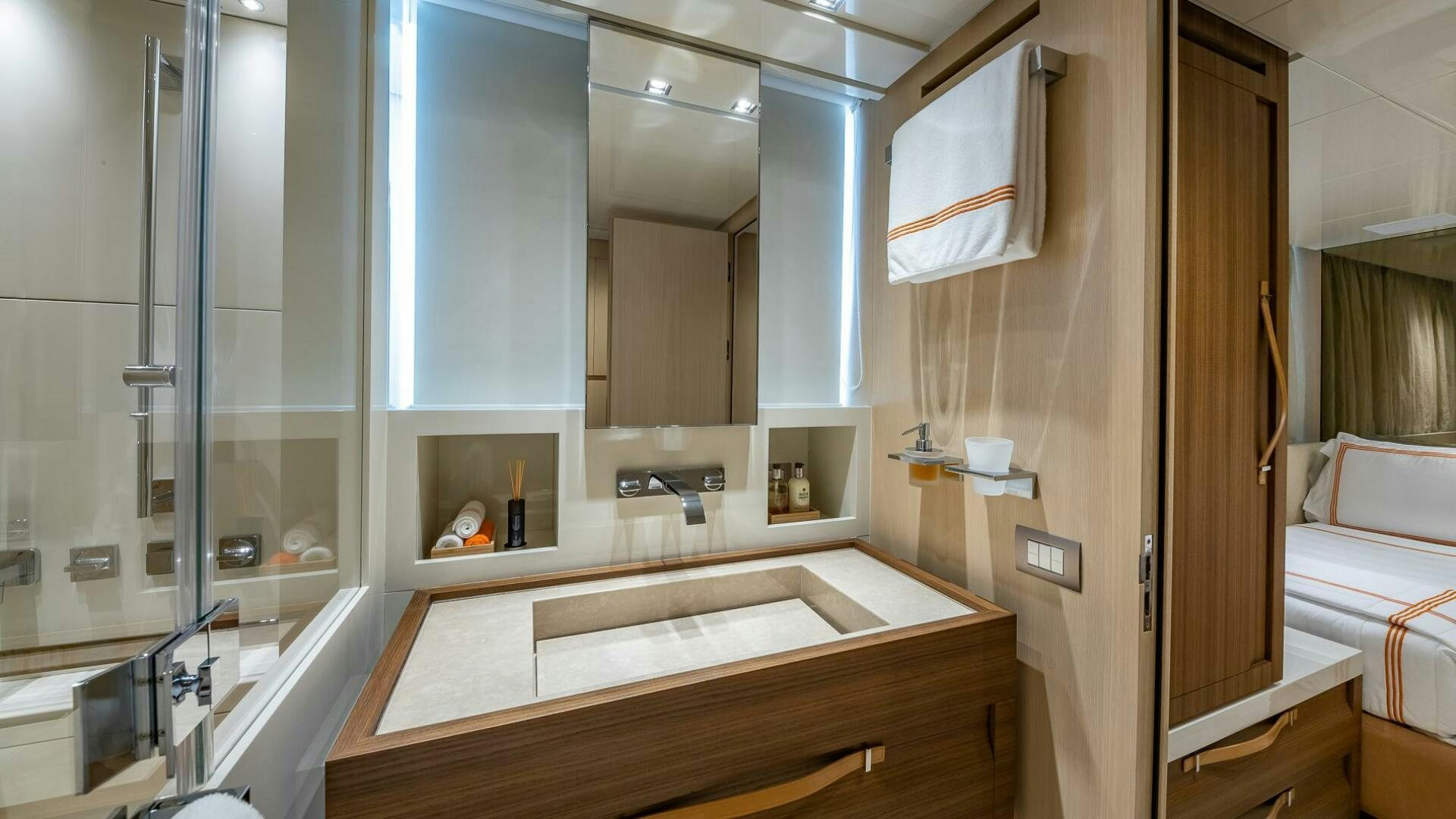 a bathroom with a large mirror aboard WOMBAT Yacht for Sale