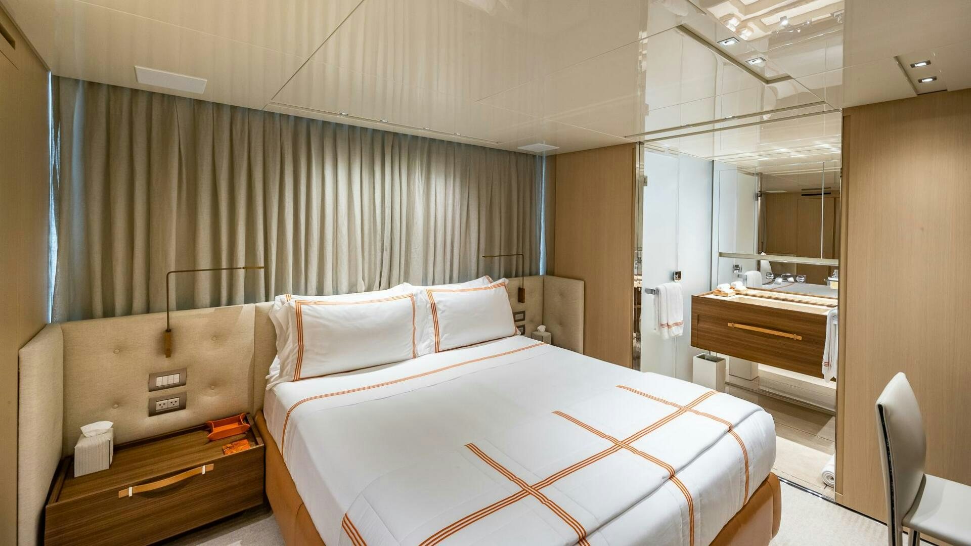 a bed in a room aboard WOMBAT Yacht for Sale