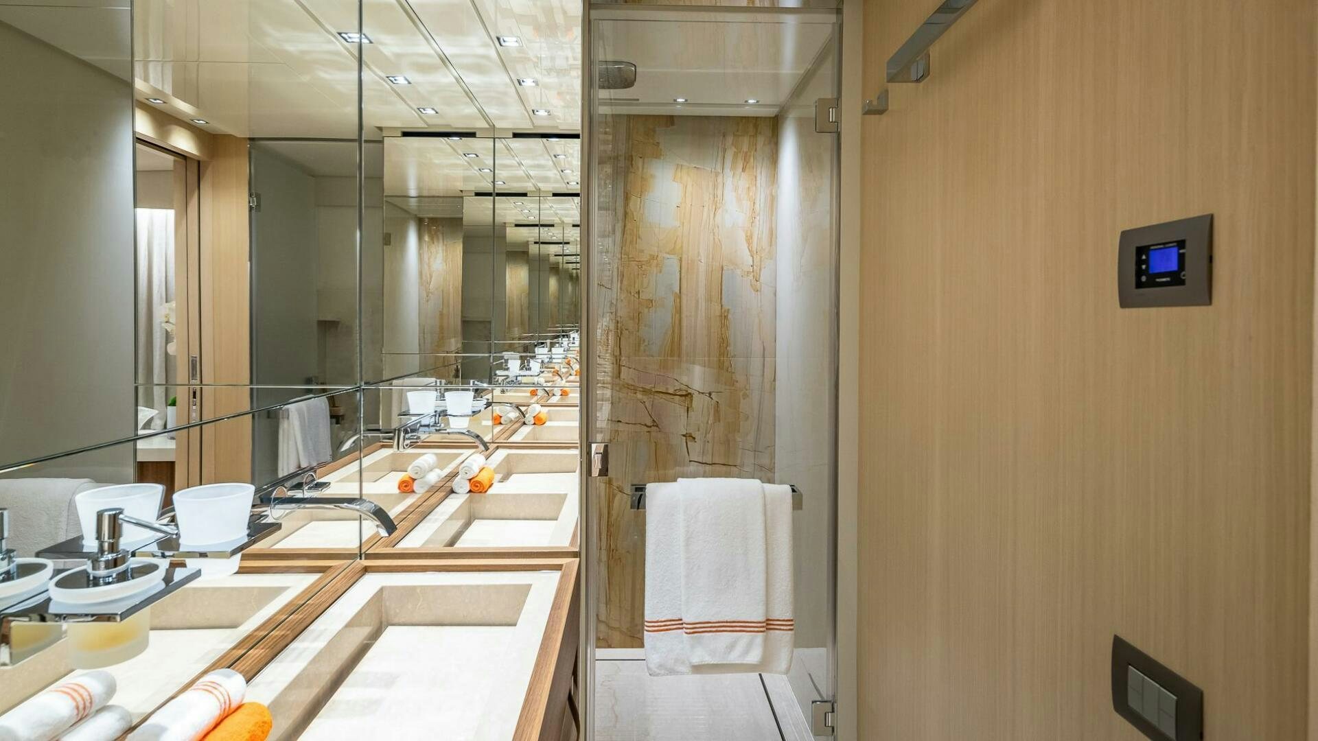 a bathroom with a large mirror aboard WOMBAT Yacht for Sale