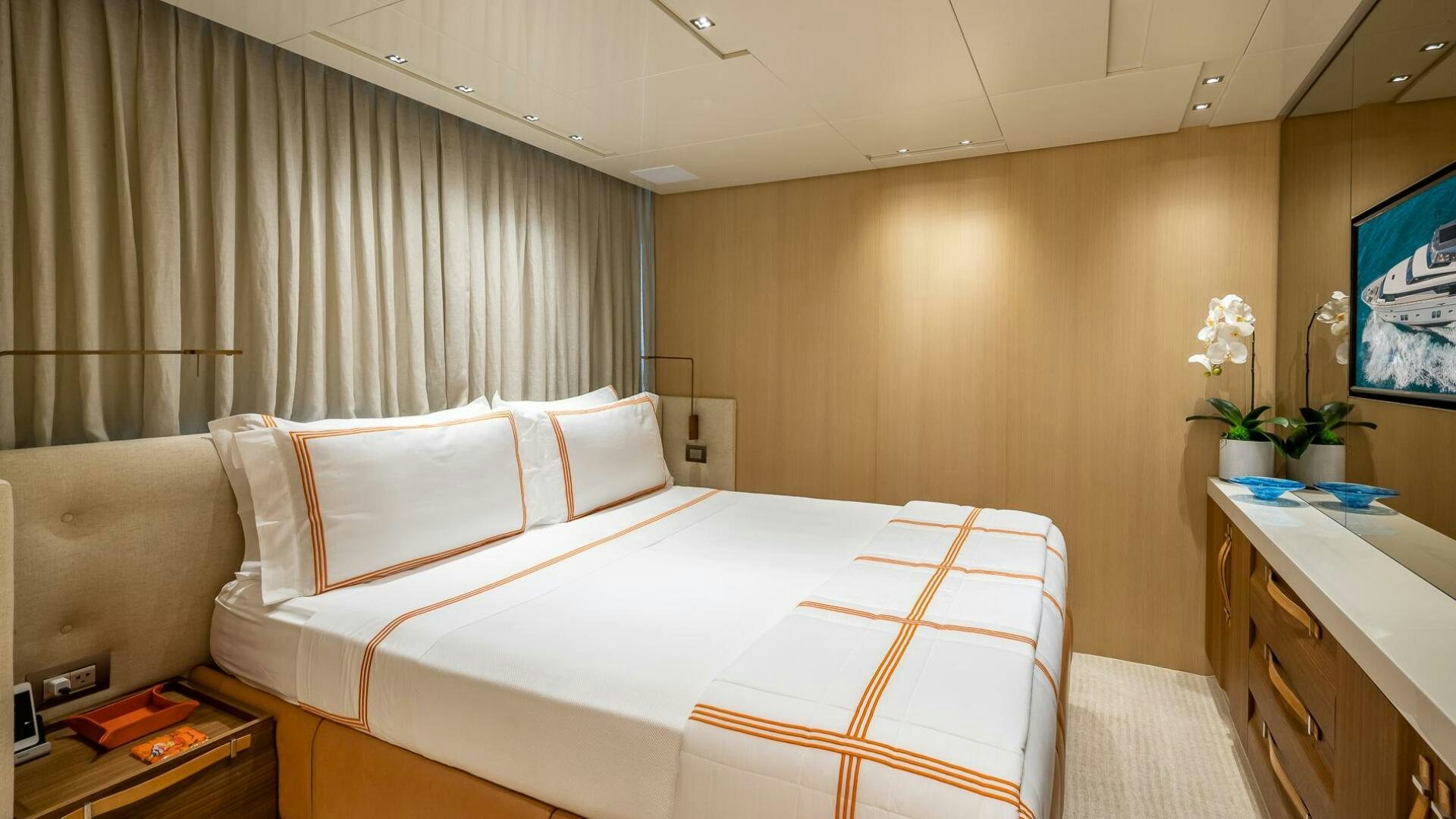 a room with a bed and a desk aboard WOMBAT Yacht for Sale