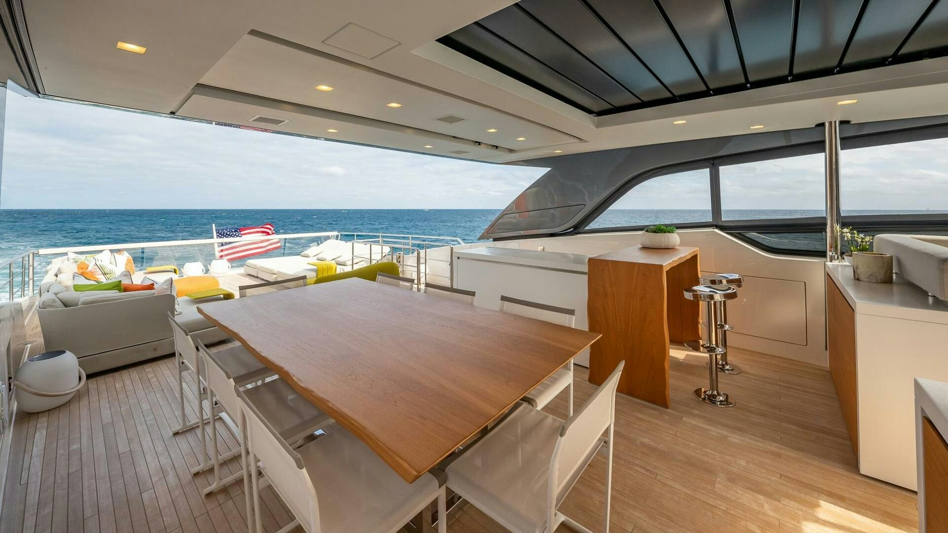 a room with a table and chairs aboard WOMBAT Yacht for Sale