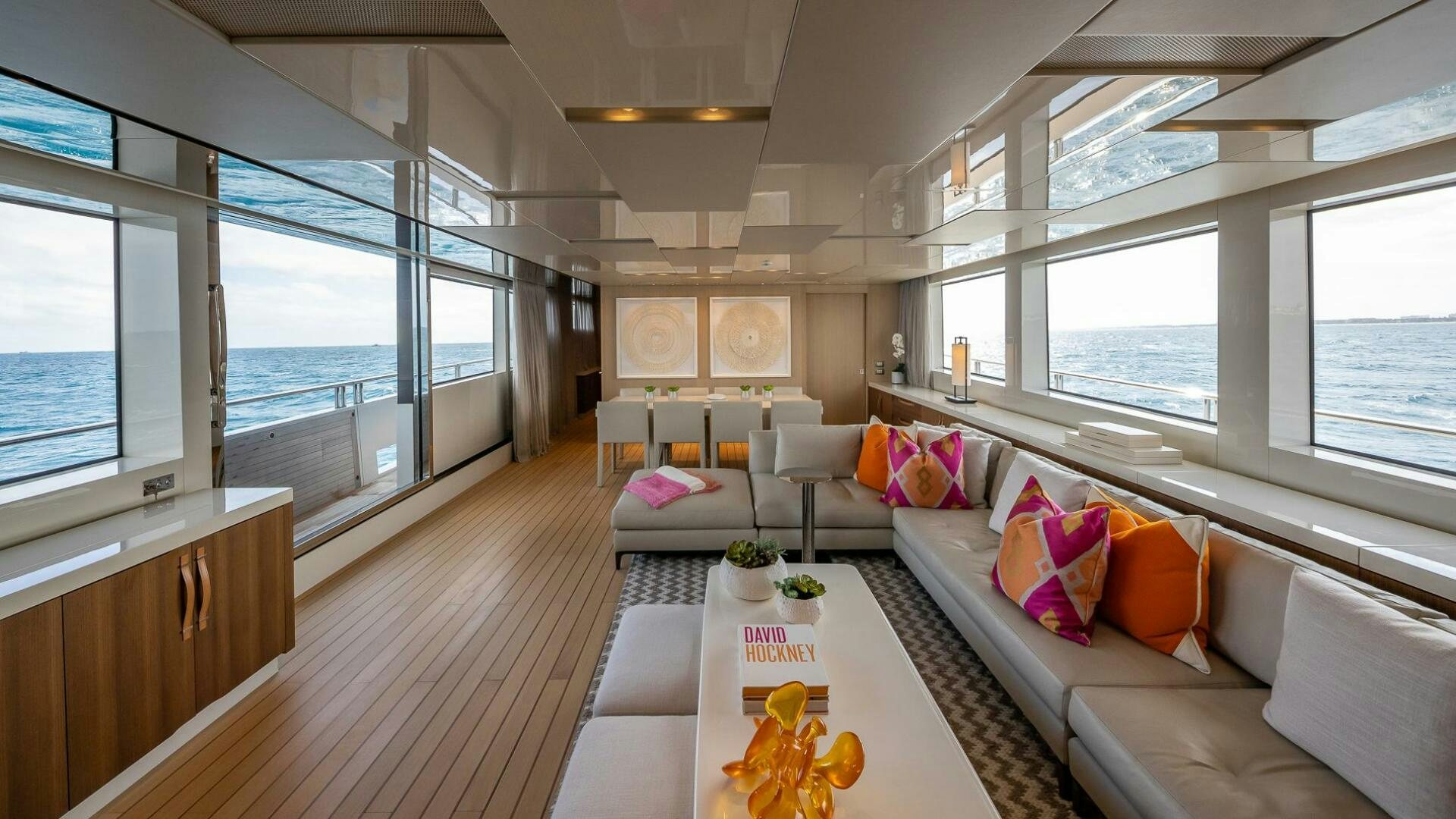 a living room with a large window aboard WOMBAT Yacht for Sale