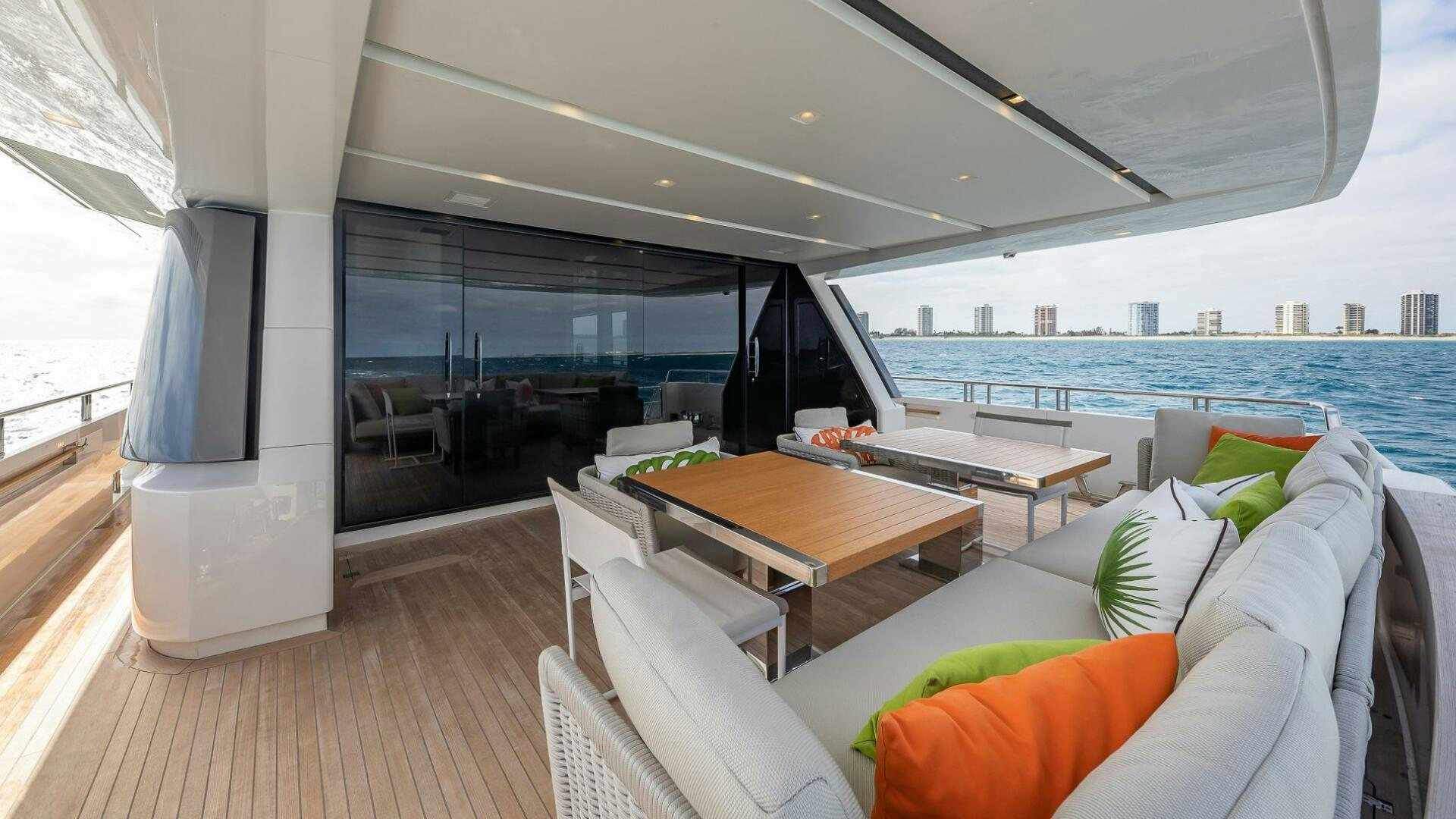 a room with a table and chairs aboard WOMBAT Yacht for Sale