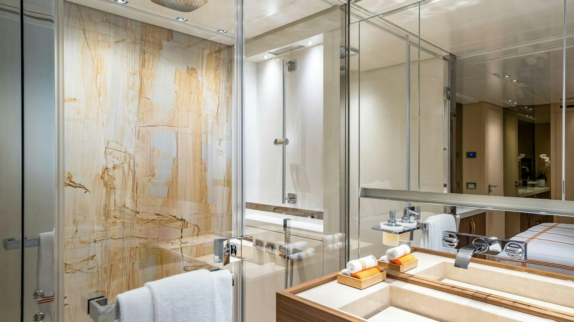 a bathroom with a large mirror aboard WOMBAT Yacht for Sale