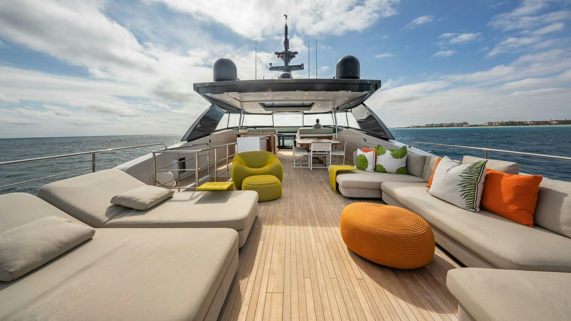 a deck with a large boat and a large black grill on it aboard WOMBAT Yacht for Sale