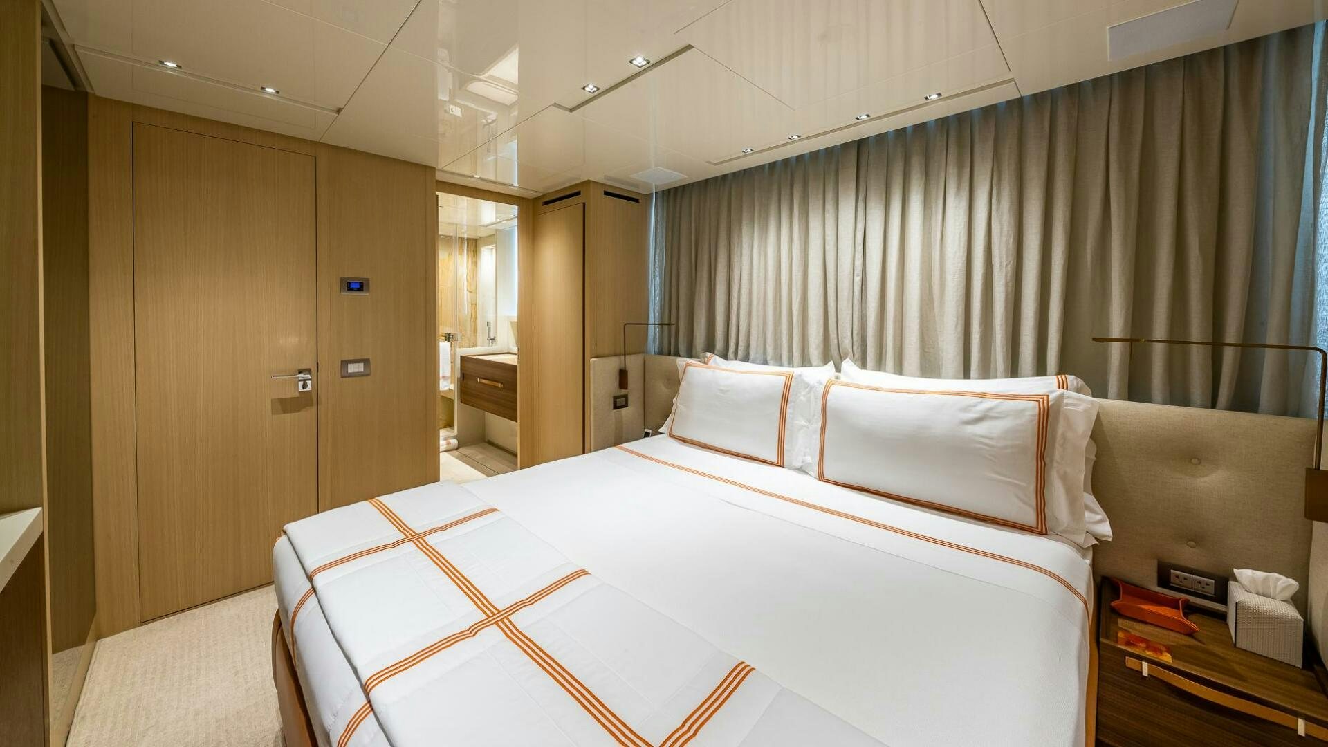 a bed in a room aboard WOMBAT Yacht for Sale