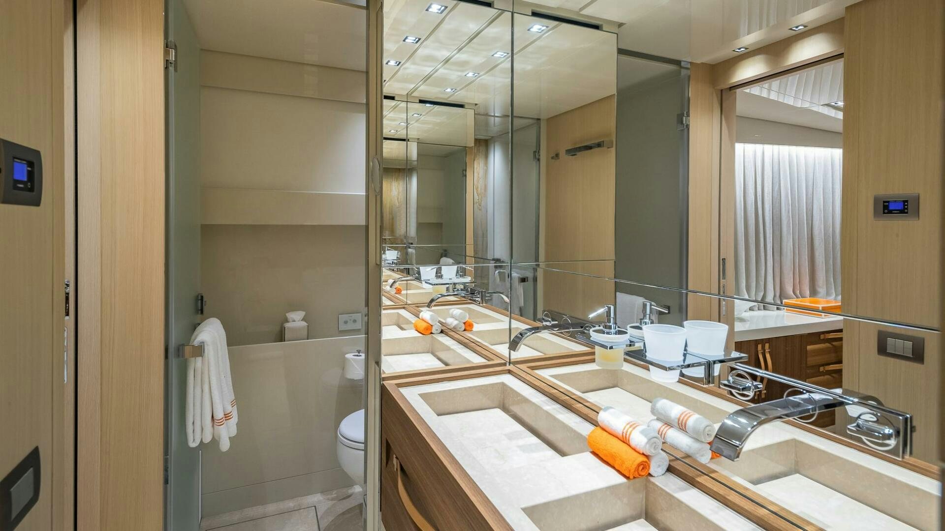 a bathroom with a large mirror aboard WOMBAT Yacht for Sale