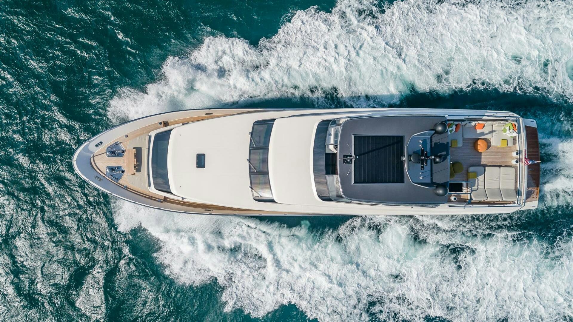 a helicopter above the ocean aboard WOMBAT Yacht for Sale