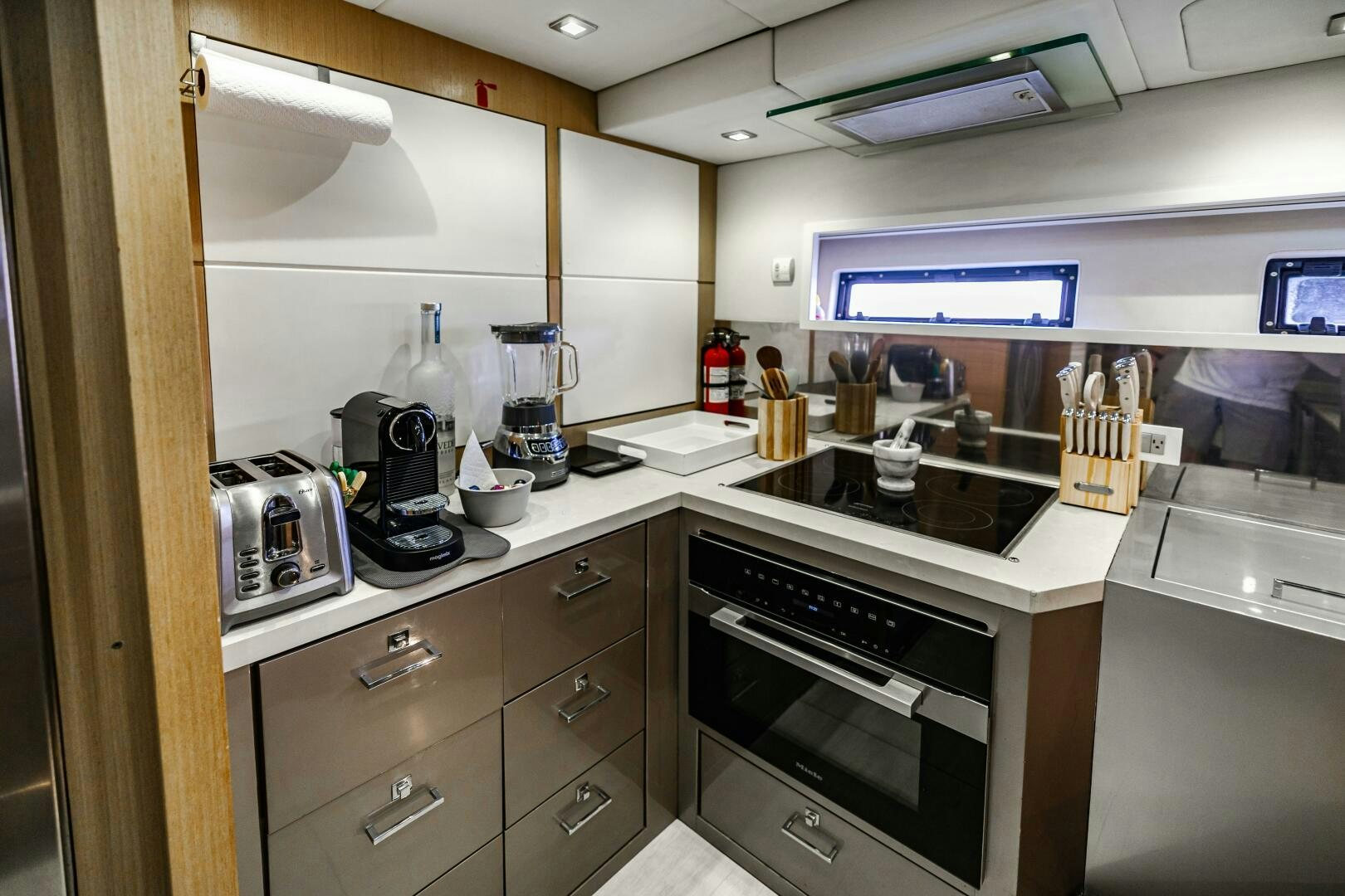 a kitchen with a stove and a sink aboard VELOCE II Yacht for Sale