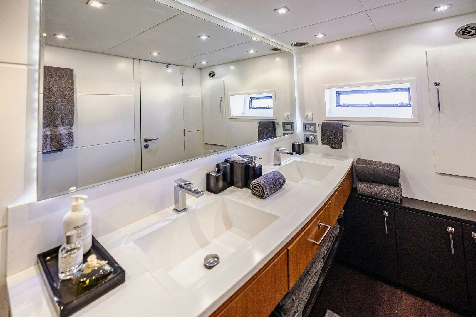 a bathroom with a large mirror aboard VELOCE II Yacht for Sale