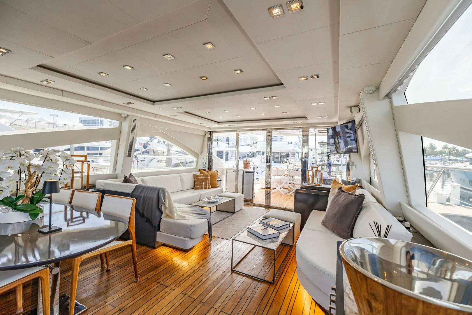 a living room with a large window aboard VELOCE II Yacht for Sale