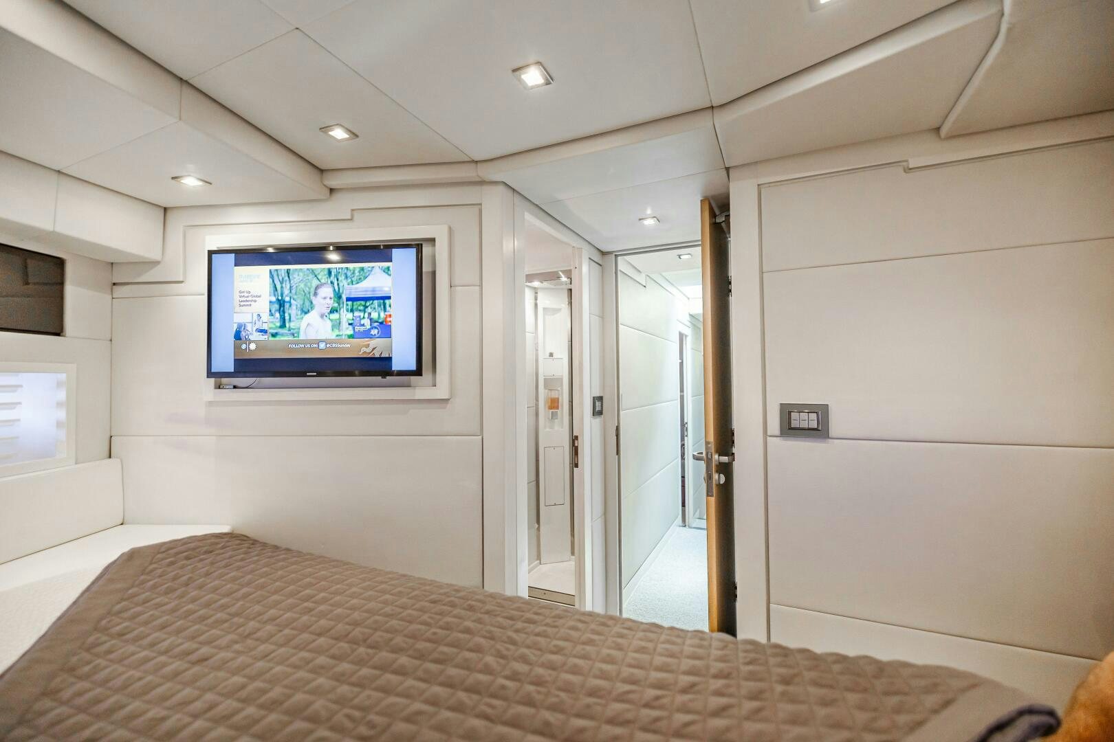 a bed with a television on it aboard VELOCE II Yacht for Sale