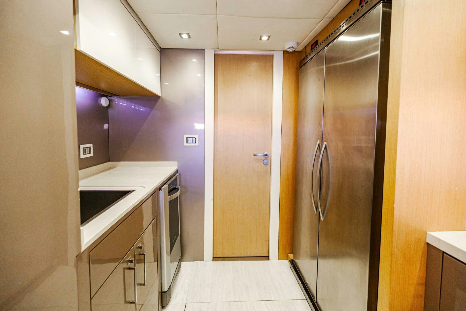 a room with a sink and a refrigerator aboard VELOCE II Yacht for Sale
