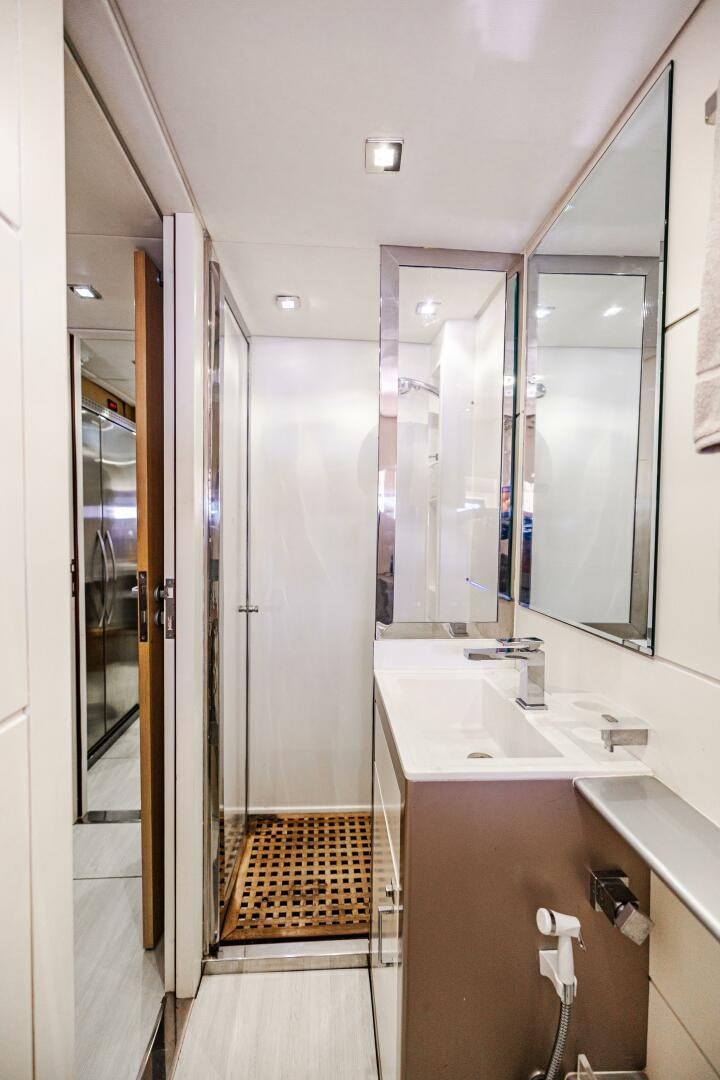 a bathroom with a sink and mirrors aboard VELOCE II Yacht for Sale