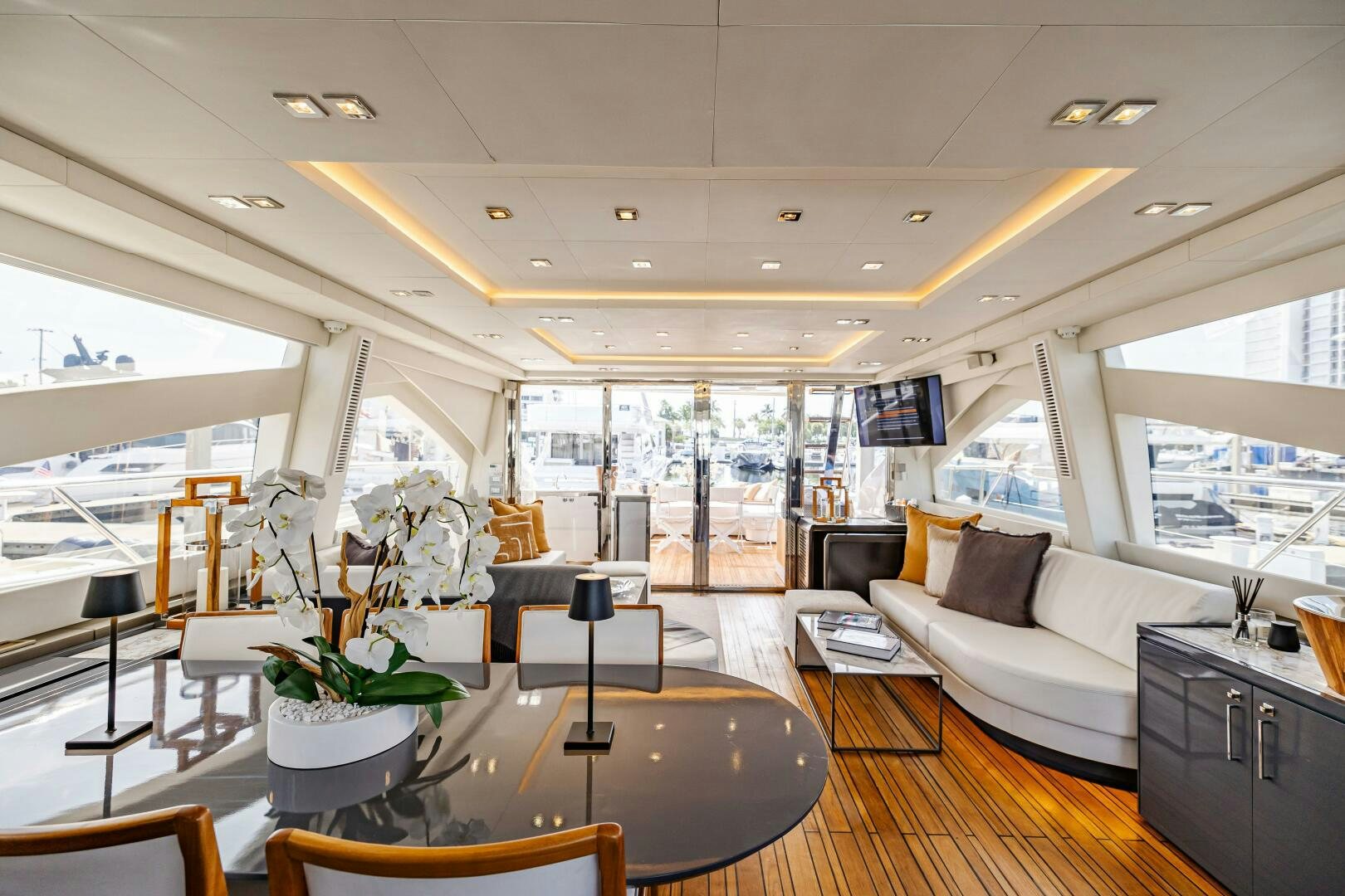 a living room with a large window aboard VELOCE II Yacht for Sale
