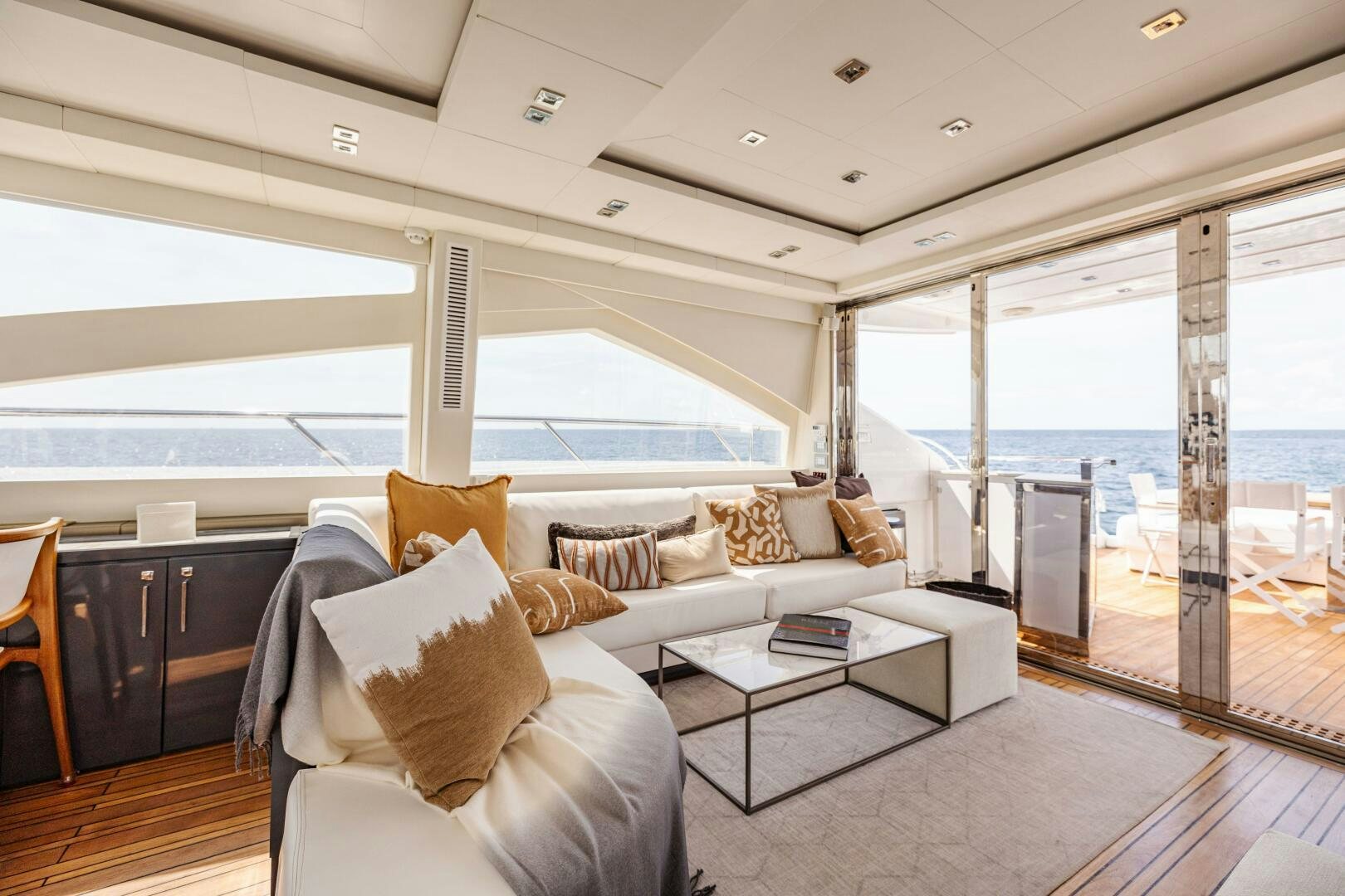a living room with a large window aboard VELOCE II Yacht for Sale